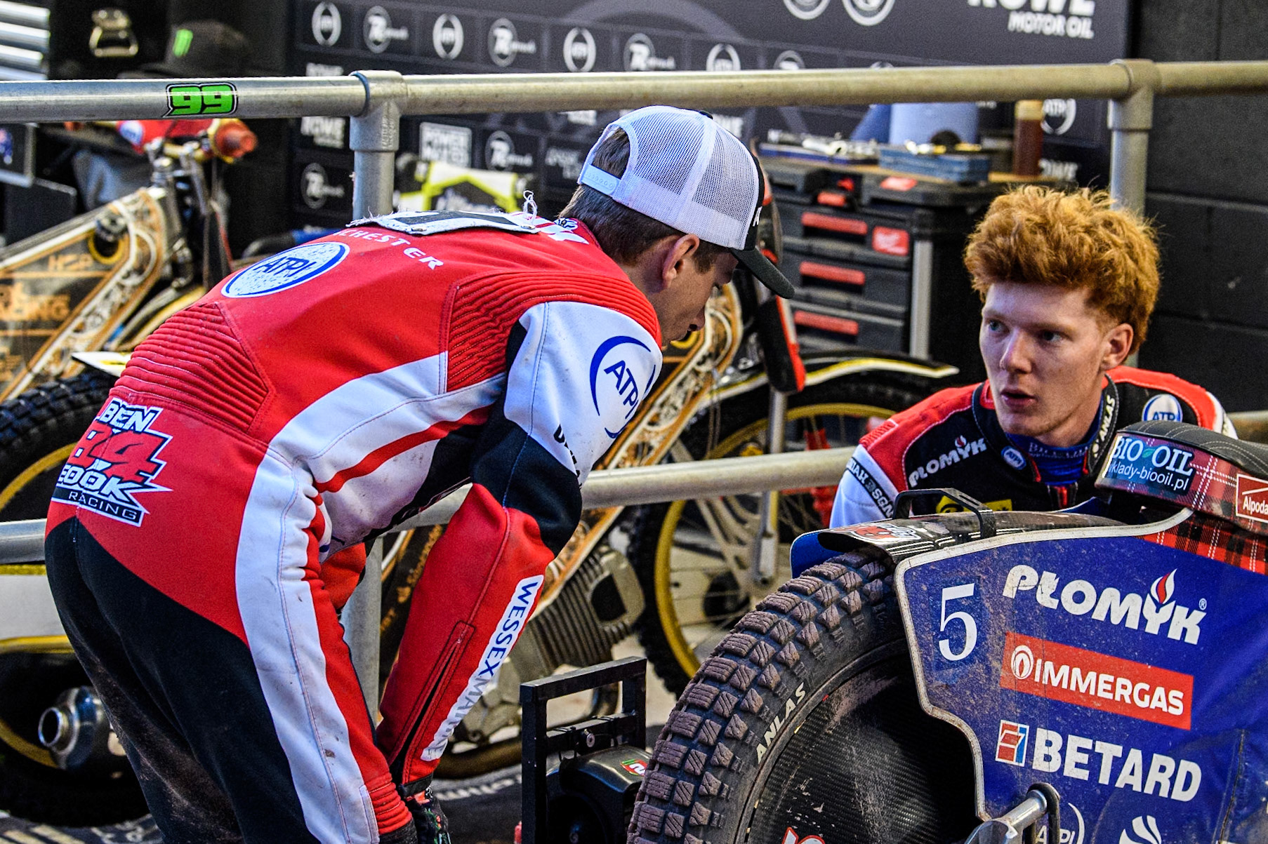 Belle Vue Aces' Ben Cook  (Left) chats with team mate Belle Vue Aces' Dan Bewley  during the Rowe Motor Oil Premiership match between Belle Vue Aces and Ipswich Witches at the National Speedway Stadium, Manchester on Monday 1st July 2024. (Photo: Ian Charles | MI News)
