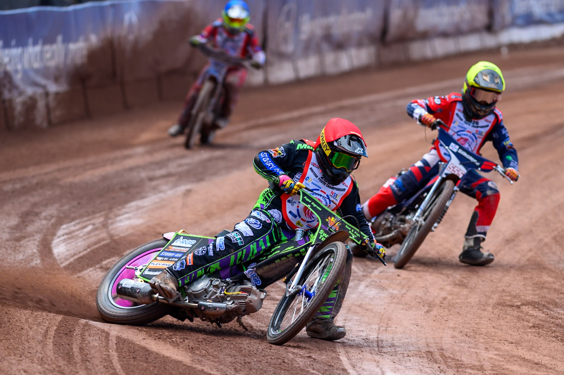BRITISH YOUTH CHAMPIONSHIP 125cc Lewis Hague (322) in Red leading Fraser Buckle (555) in Yellow and Ella Marshall (12)  in Blue during the  British Youth Championship (125cc) at the National Speedway Stadium, Manchester on Sunday 19th July 2026. (Photo: Ian Charles | MI News)