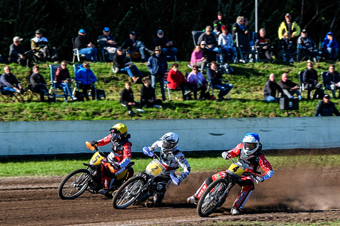 Kenneth K. Hansen (Blue) inside Hynek Stichauer (White) and Jacob Bukhave (Yellow) during the FIM Long Track Of Nations event at the Speed Centre Roden on Sunday 24th September 2023. (Photo: Ian Charles | MI News)