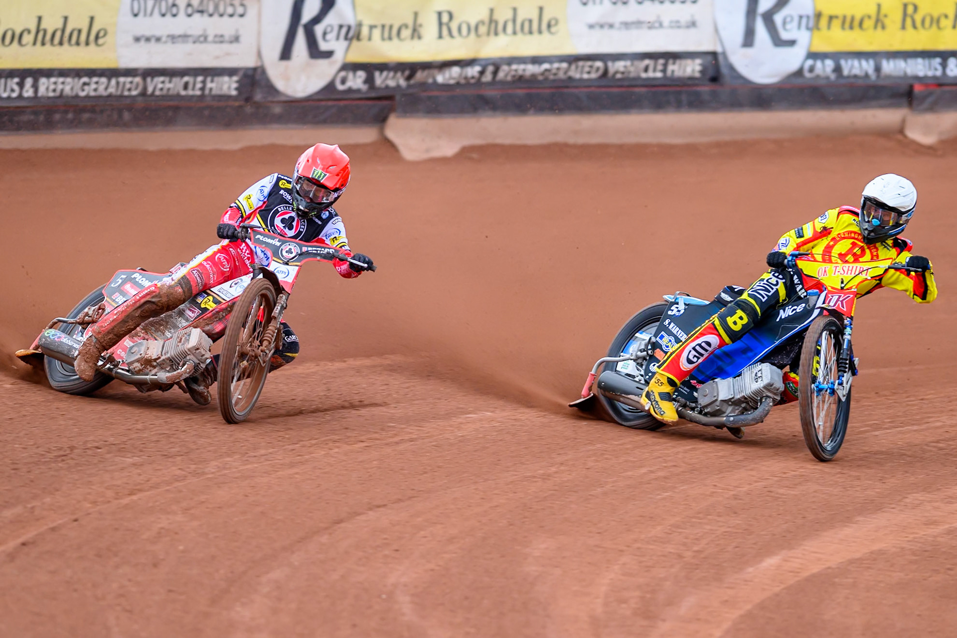Belle Vue Aces' Dan Bewley  in Red rides outside Birmingham Brummies' Matej Zagar  in White during the Rowe Motor Oil Premiership match between Belle Vue Aces and Birmingham Brummies at the National Speedway Stadium, Manchester on Monday 7th July 2025. (Photo: Ian Charles | MI News)