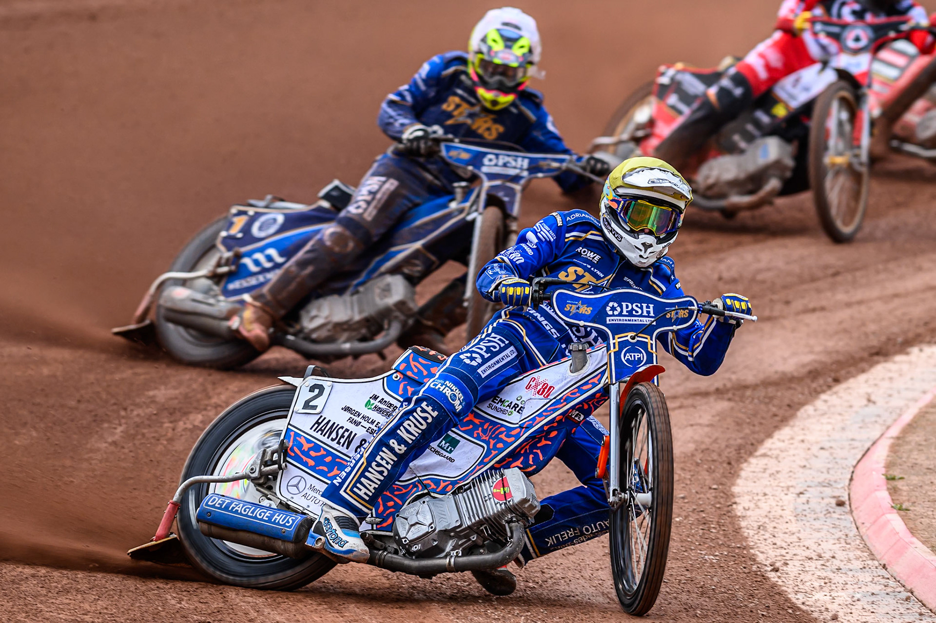 Kings Lynn Stars' Niels-Kristian Iversen in Yellow leading Kings Lynn Stars' Richard Lawson in White during the Rowe Motor Oil Premiership match between Belle Vue Aces and King's Lynn Stars at the National Speedway Stadium, Manchester on Monday 23rd June 2025. (Photo: Ian Charles | MI News)