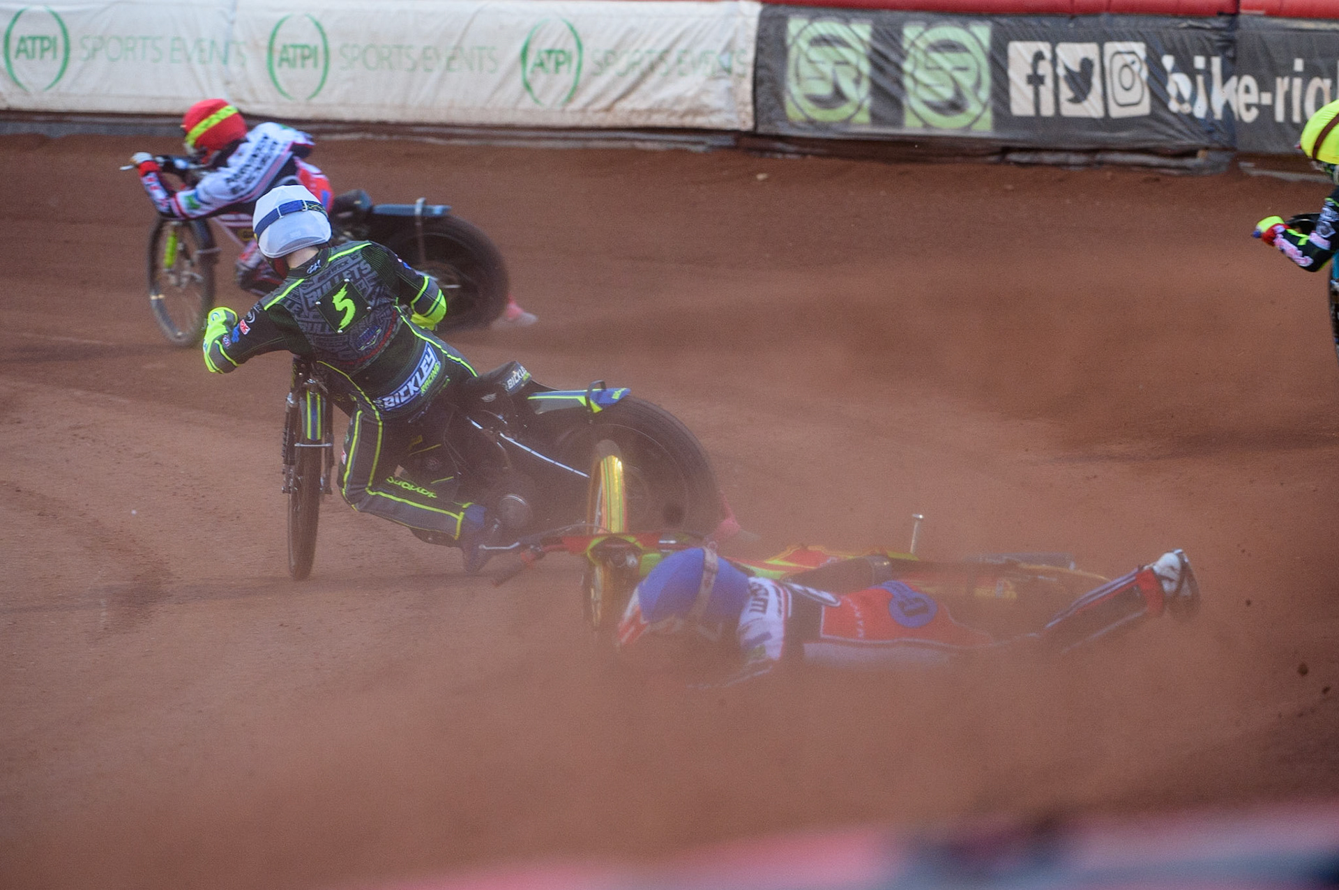 MANCHESTER, UK. MAY 28TH  Ben Woodhull  falls behind Kyle Bickley (White) and Jack Parkinson-Blackburn  (Red) during the SGB National Development League match between Belle Vue Colts and Berwick Bullets at the National Speedway Stadium, Manchester on Friday 28th May 2021. (Credit: Ian Charles | MI News)