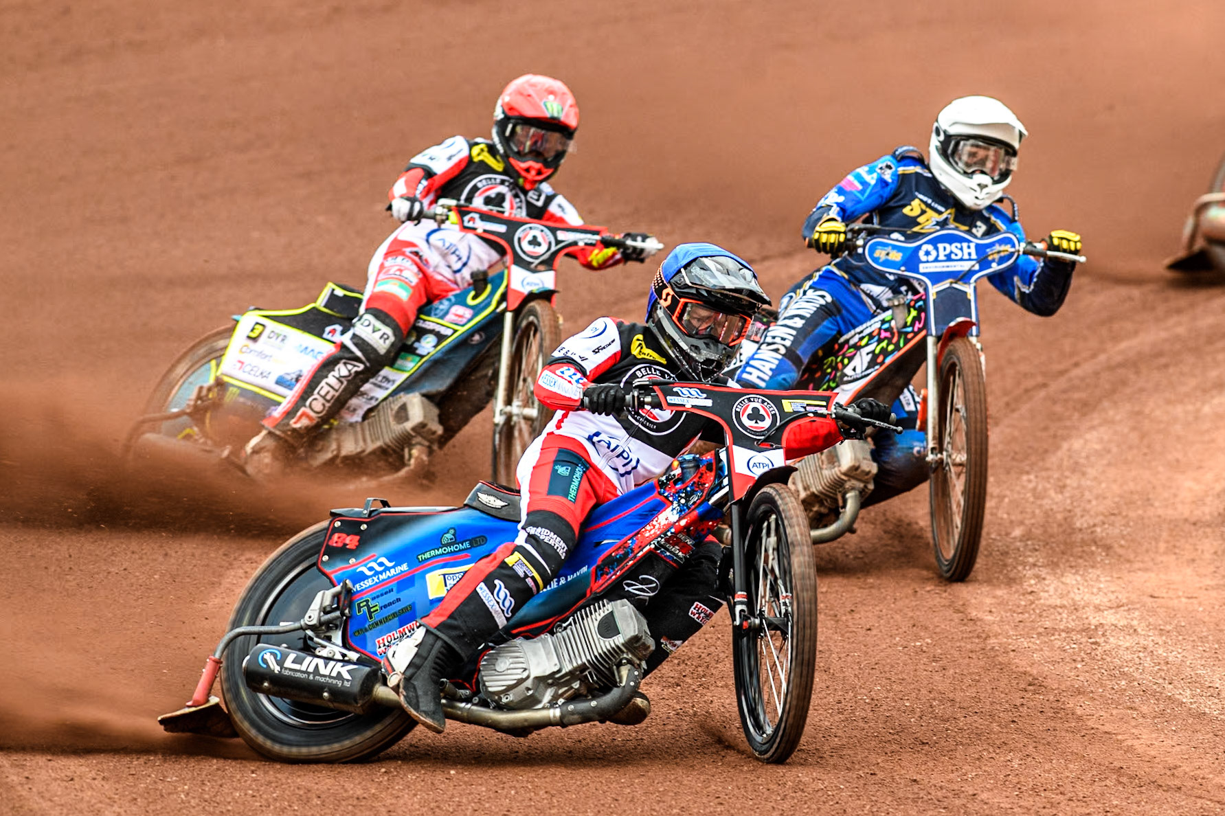Belle Vue Aces' Ben Cook in Blue and Belle Vue Aces' Jaimon Lidsey in Red leading King Lynn Stars' Niels-Kristian Iversen in White during the Rowe Motor Oil Premiership match between Belle Vue Aces and King's Lynn Stars at the National Speedway Stadium, Manchester on Monday 20th May 2024. (Photo: Ian Charles | MI News)