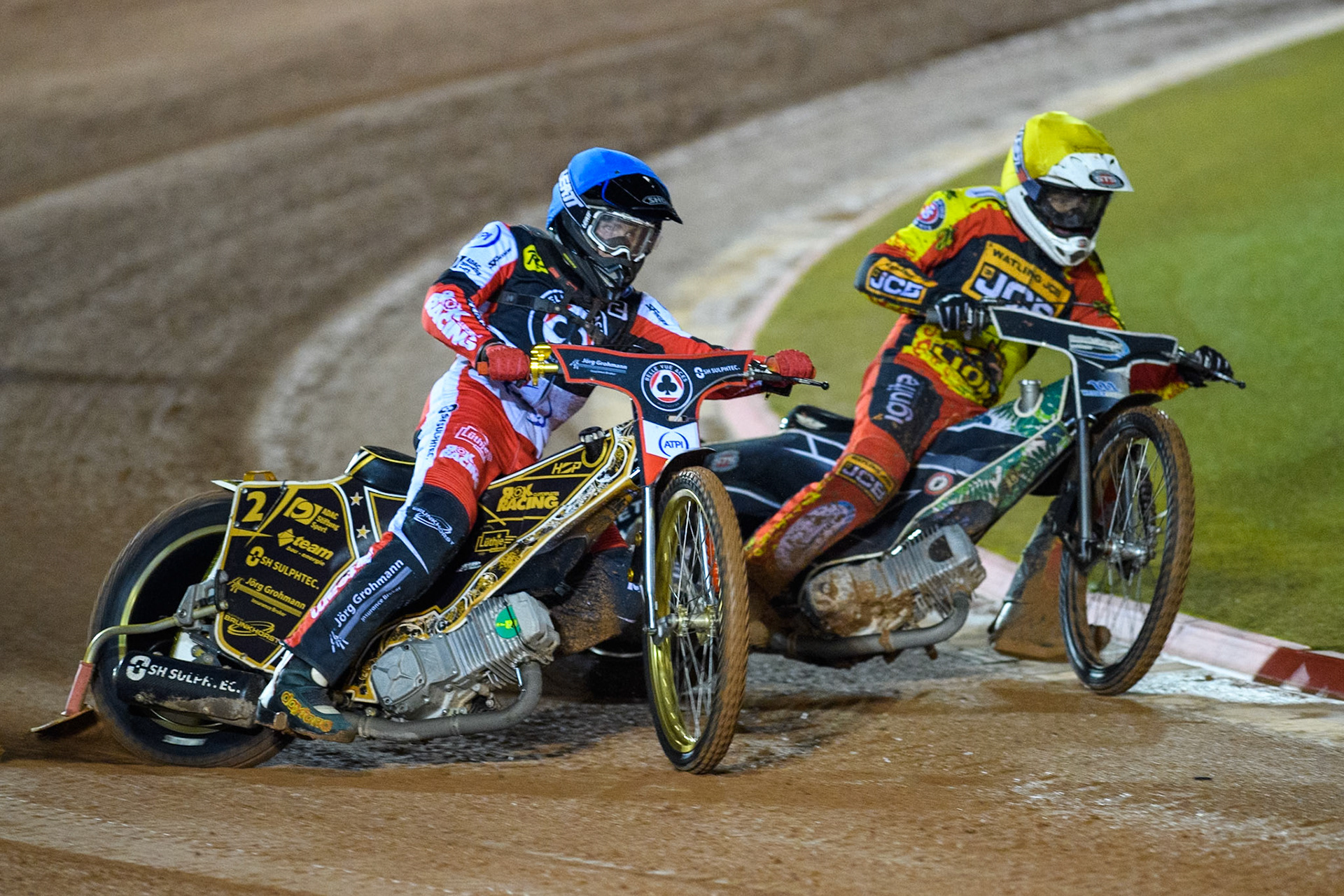 Belle Vue Aces' Norick Blodorn in Blue rides outside Leicester Lions' Richard Lawson in Yellow during the Rowe Motor Oil Premiership Grand Final 1st Leg between Belle Vue Aces and Leicester Lions at the National Speedway Stadium, Manchester on Monday 23rd September 2024. (Photo: Ian Charles | MI News)