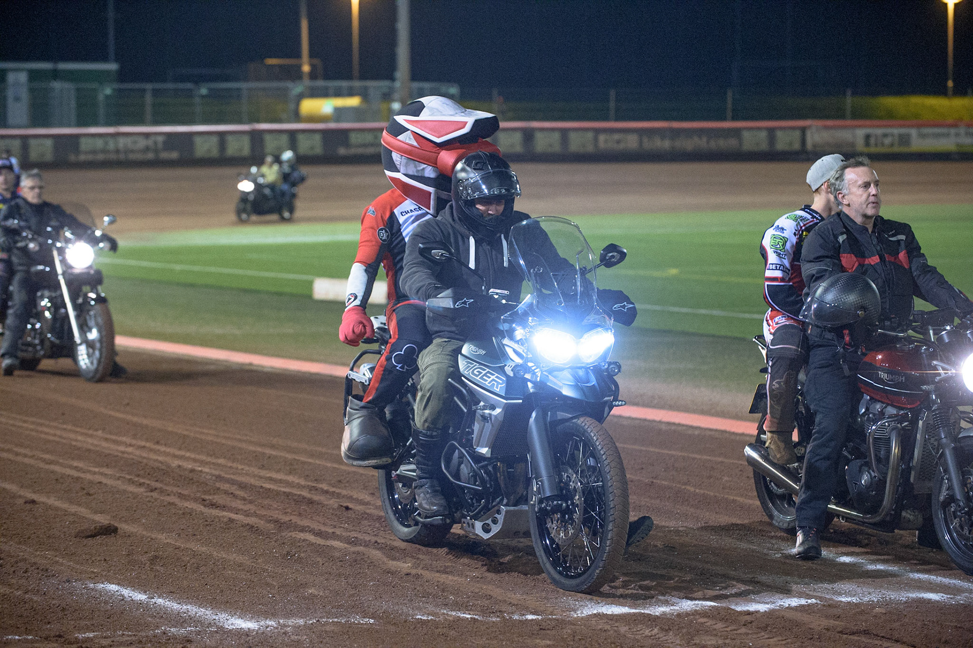 MANCHESTER, UK. SEPT 6TH  The riders on the back of Triumph motorcycles belonging to the Triumph owners club who attended the meeting during the SGB Premiership match between Belle Vue Aces and Sheffield Tigers at the National Speedway Stadium, Manchester on Monday 6th September 2021. (Credit: Ian Charles | MI News)