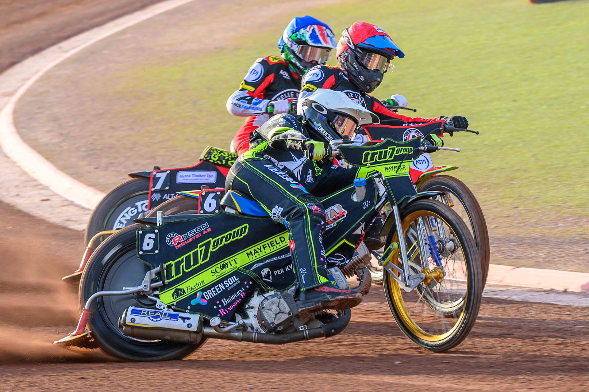 Tate Zischke of Belle Vue Aces in Red and William Cairns of Belle Vue Aces in White ride inside Philip Hellstrom-Bangs of Ipswich Witches in White during the Rowe Motor Oil Premiership match between Belle Vue Aces and Ipswich Witches at the National Speedway Stadium, Manchester on Saturday 20th June 2026. (Photo: Ian Charles | MI News)