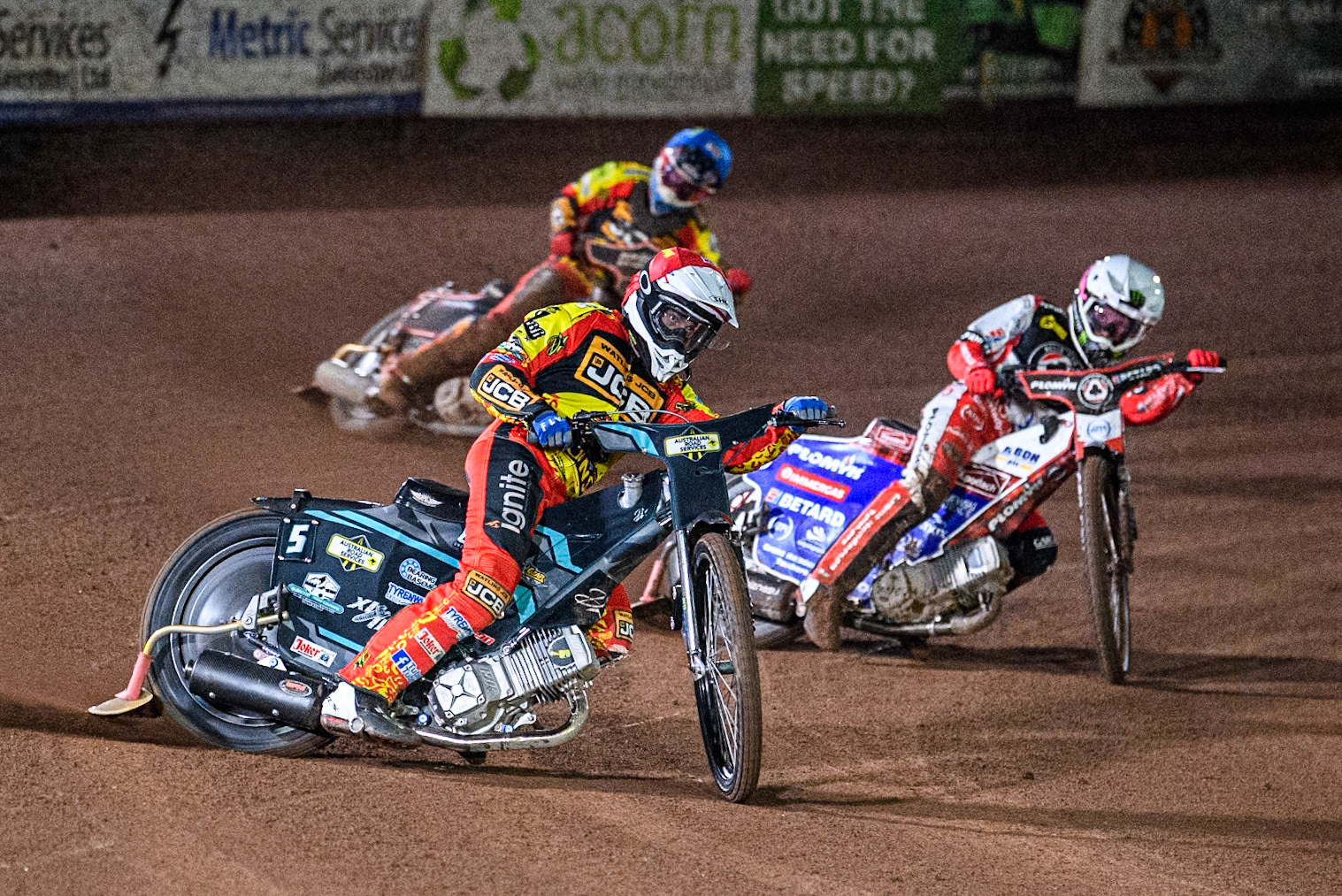 Leicester Lions' Ryan Douglas in Red leading Belle Vue Aces' Dan Bewley in White and Leicester Lions' Sam Hagon in Blue during the Rowe Motor Oil Premiership Grand Final 2nd Leg between Leicester Lions and Belle Vue Aces at the Pidcock Motorcycles Arena, Leicester on Thursday 26th September 2024. (Photo: Ian Charles | MI News)