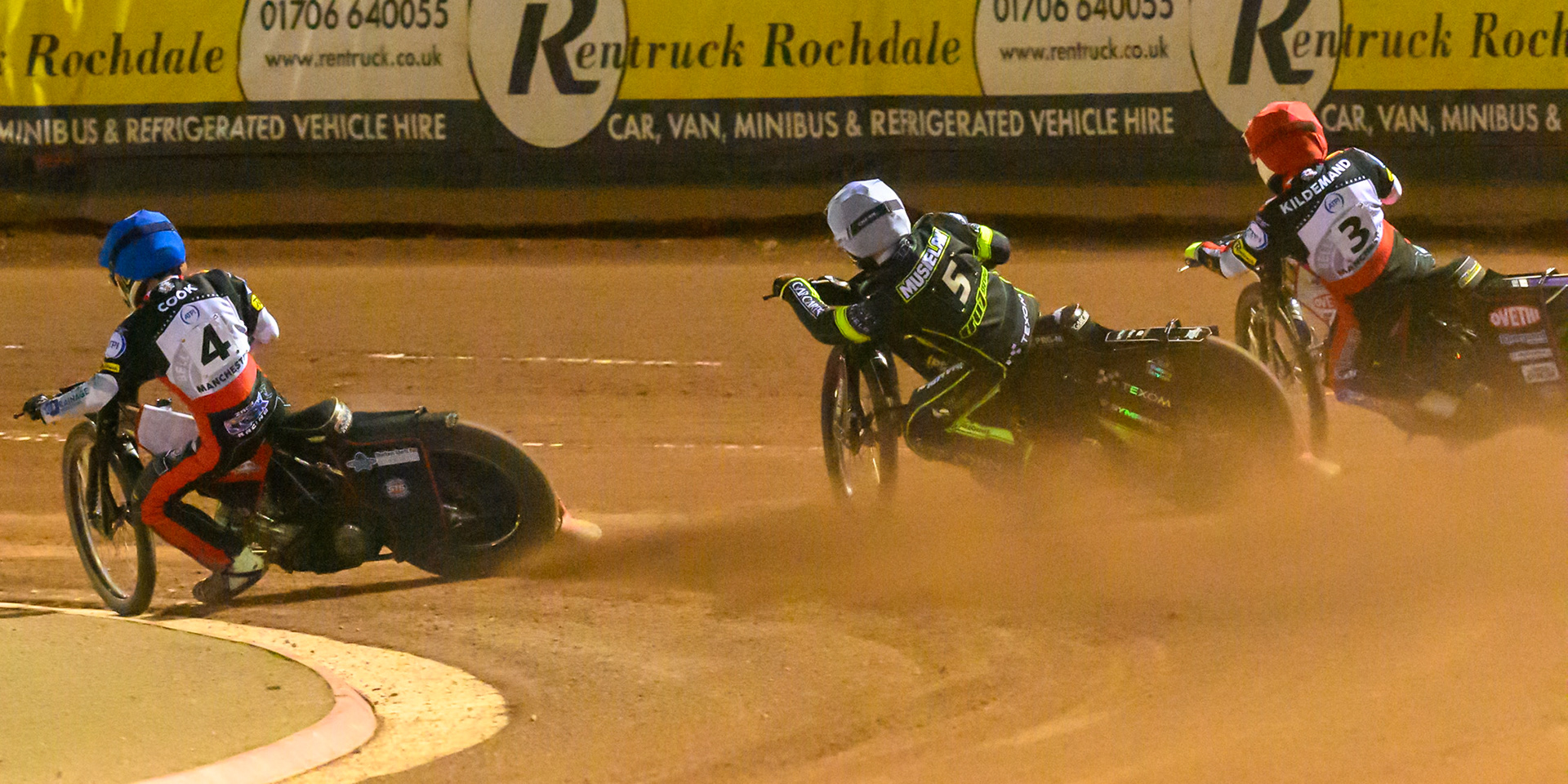 Zach Cook of Belle Vue Aces in Blue on the inside of Tobias Musielak of Ipswich Witches in White  and Peter Kildemand of Belle Vue Aces in Red during the Rowe Motor Oil Premiership Play Off Semi Final 2nd leg match between Belle Vue Aces and Ipswich Witches at the National Speedway Stadium, Manchester on Monday 28th September 2026. (Photo: Ian Charles | MI News)