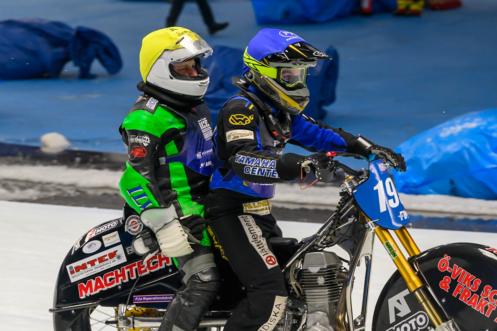 Andrej Divis (107) of Czechia gets a ride back to the pits after his fall from Martin Haarahiltunen (199) of Sweden during the Ice Speedway Gladiators World Championship Final 2 at Max-Aicher-Arena, Inzell on Sunday 15th March 2026. (Photo: Ian Charles | MI News)