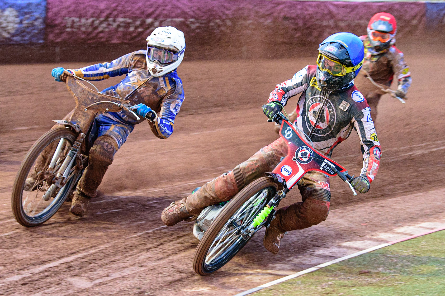 MANCHESTER, UK. MAY 16TH Charles Wright  (Blue) inside Josh Pickering  (White) with Michael Palm-Toft  (Red) behind during the SGB Premiership match between Belle Vue Aces and King's Lynn Stars at the National Speedway Stadium, Manchester on Monday 16th May 2022. (Credit: Ian Charles | MI News)