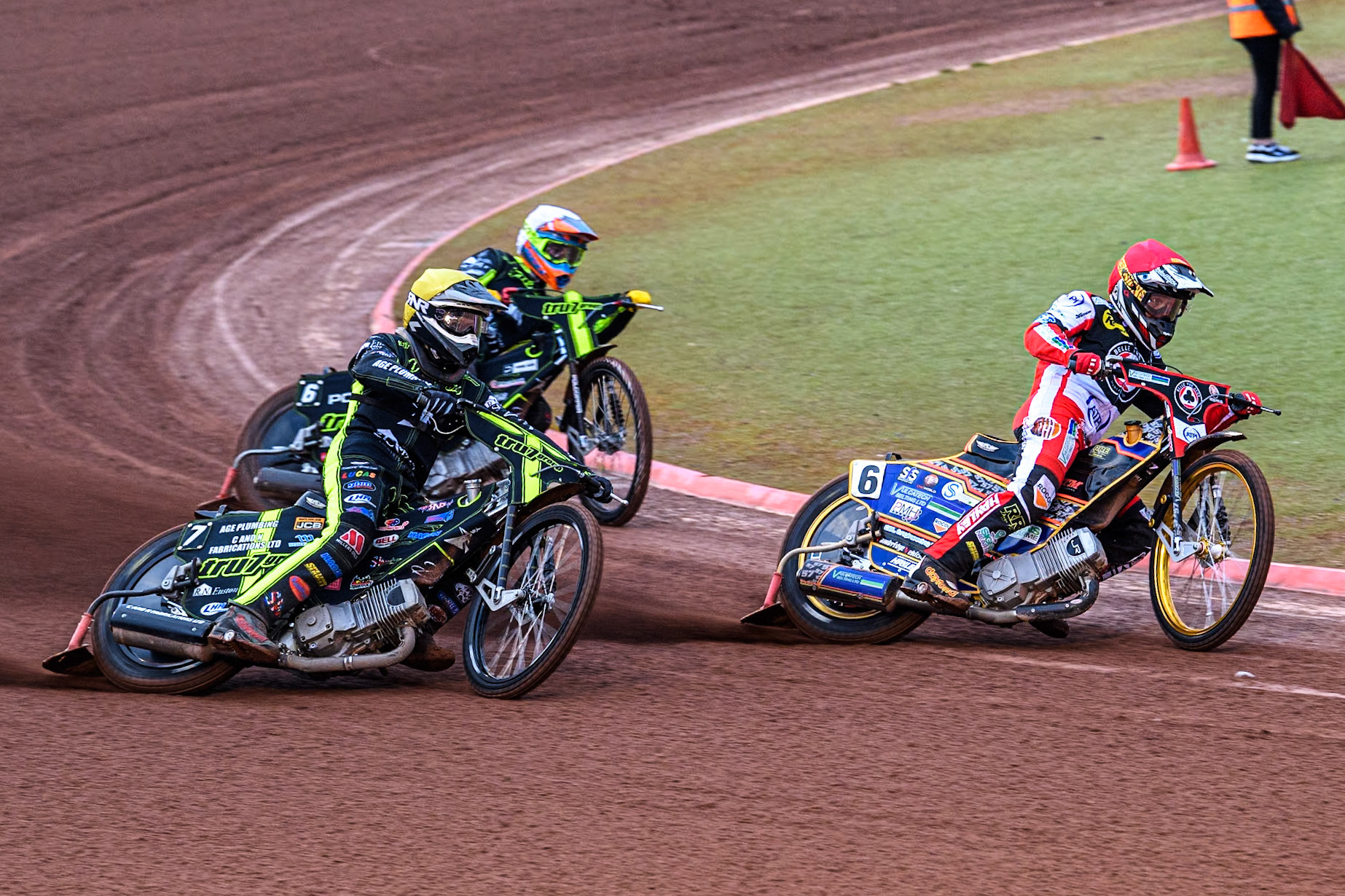 Belle Vue Aces' Connor Mountain in Red leading Ipswich Witches' Keynan Rew in White and Ipswich Witches' Dan Thompson in Yellow during the Rowe Motor Oil Premiership match between Belle Vue Aces and Ipswich Witches at the National Speedway Stadium, Manchester on Monday 22nd April 2024. (Photo: Ian Charles | MI News)