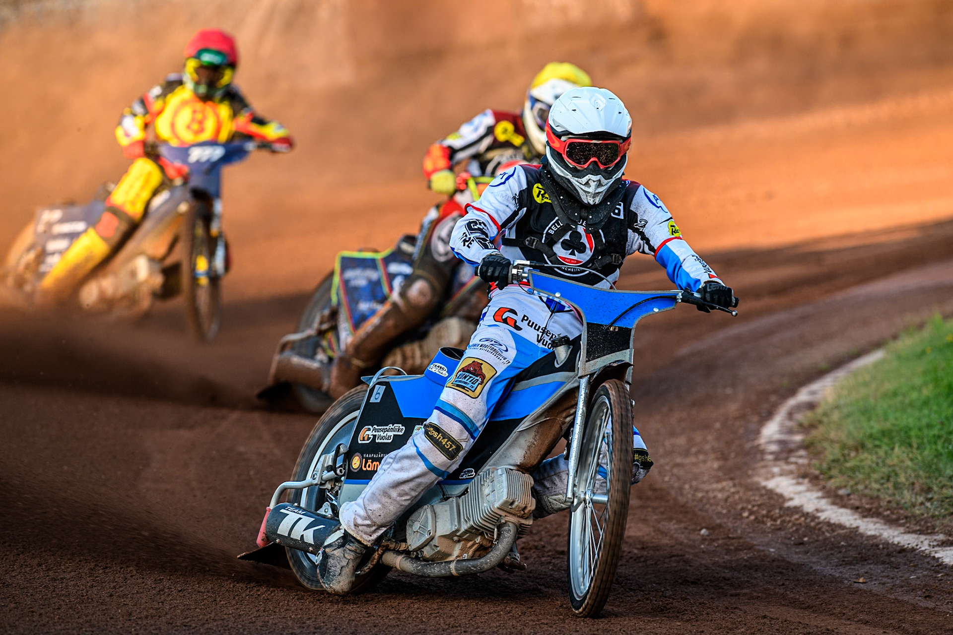 Belle Vue Aces' Antti Vuolas in White and Belle Vue Aces' Jake Mulford in Yellow leading Birmingham Brummies' Piotr Pawlicki in Red during the Rowe Motor Oil Premiership match between Birmingham Brummies and Belle Vue Aces at Perry Bar Stadium, Birmingham on Monday 29th July 2024. (Photo: Ian Charles | MI News)