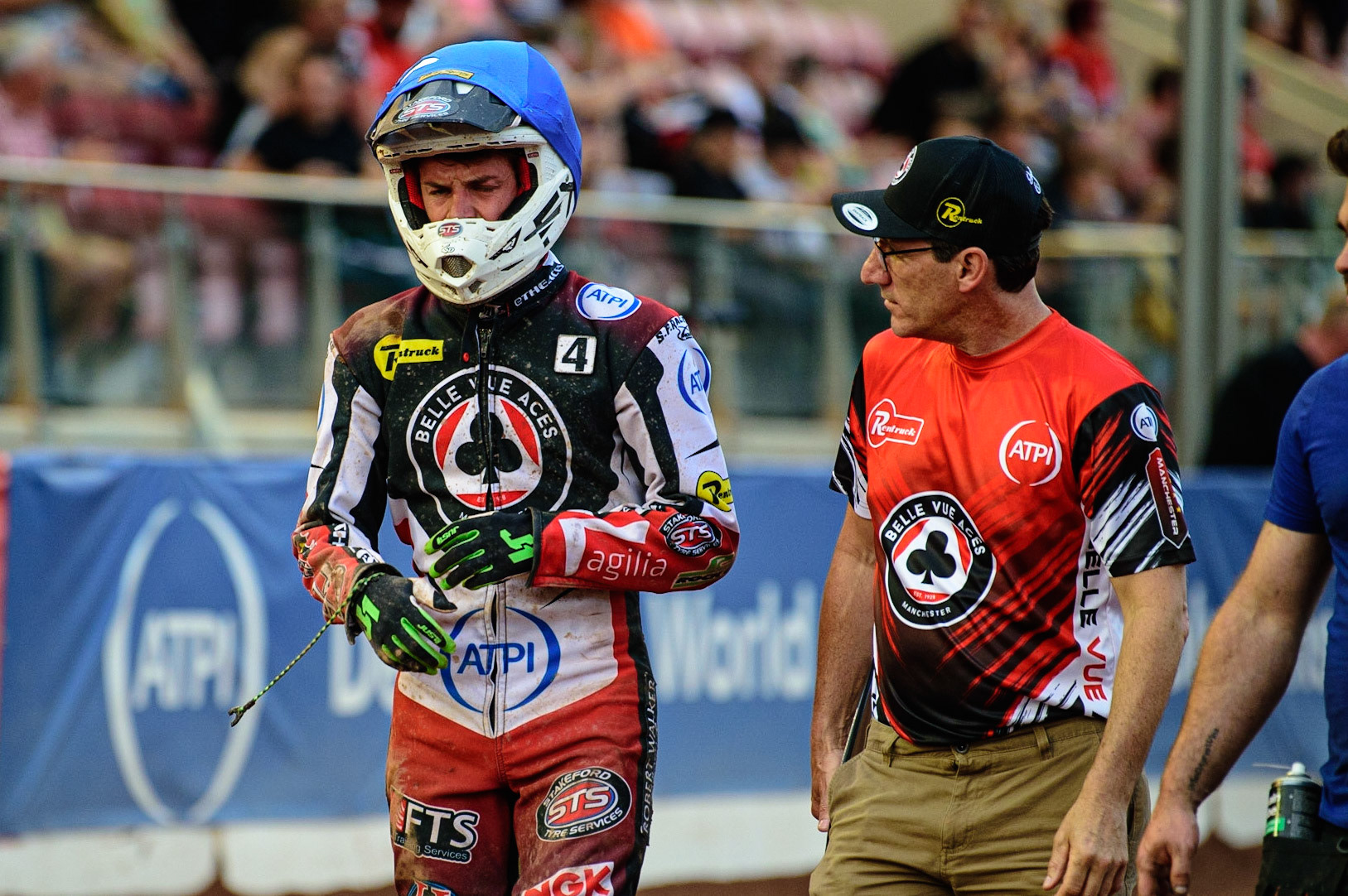 MANCHESTER UK  Charles Wright (left) walks back to the pits with Team Manager Mark Lemon  after his Heat 9 fall during the SGB Premiership match between Belle Vue Aces and King's Lynn Stars at the National Speedway Stadium, Manchester on Monday 11th July 2022. (Credit: Ian Charles | MI News)