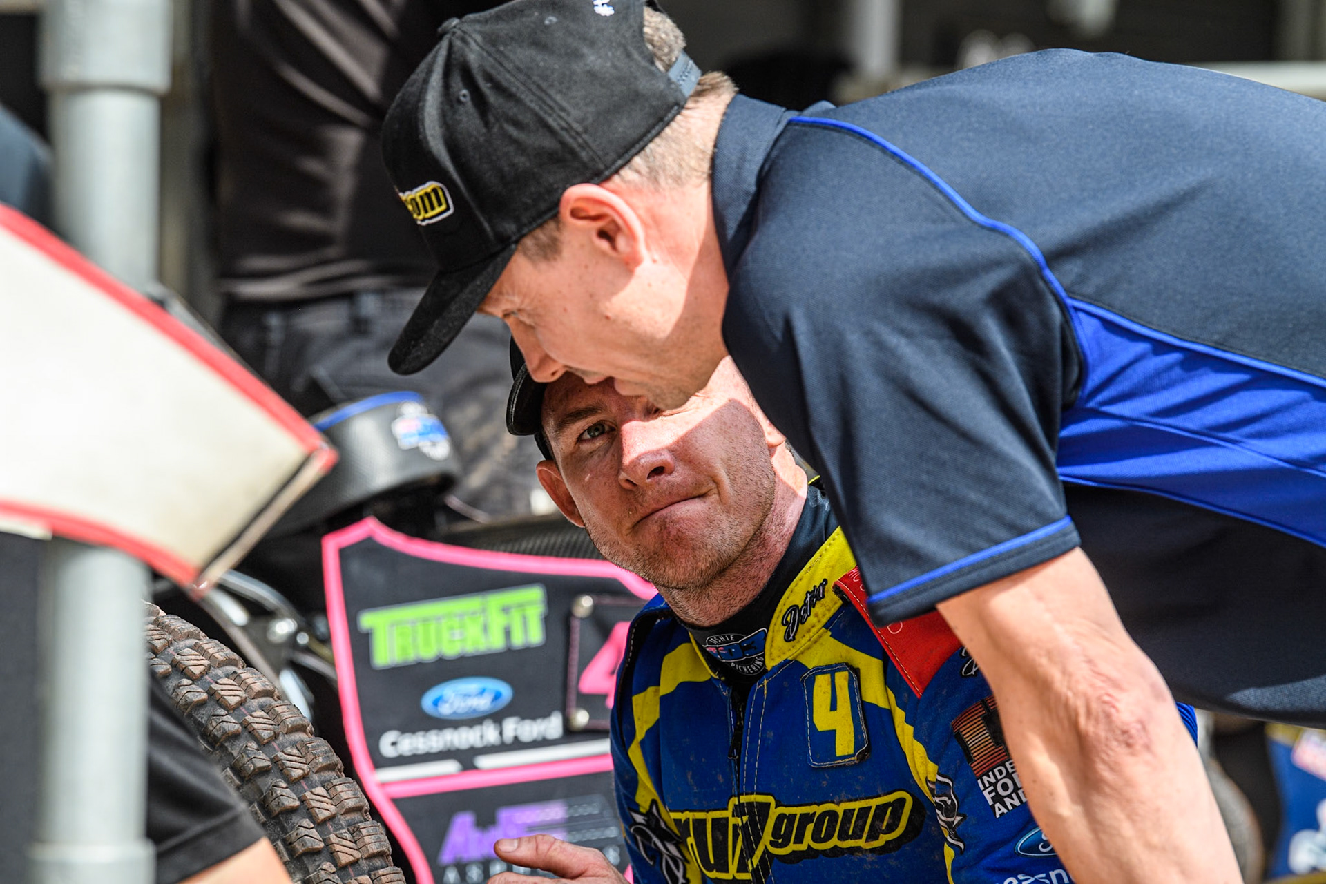 Sheffield Tigers' Team Manager Simon Stead (nearest camera) with Sheffield Tigers' Josh Pickering  during the Rowe Motor Oil Premiership match between Belle Vue Aces and Sheffield Tigers at the National Speedway Stadium, Manchester on Monday 26th August 2024. (Photo: Ian Charles | MI News)