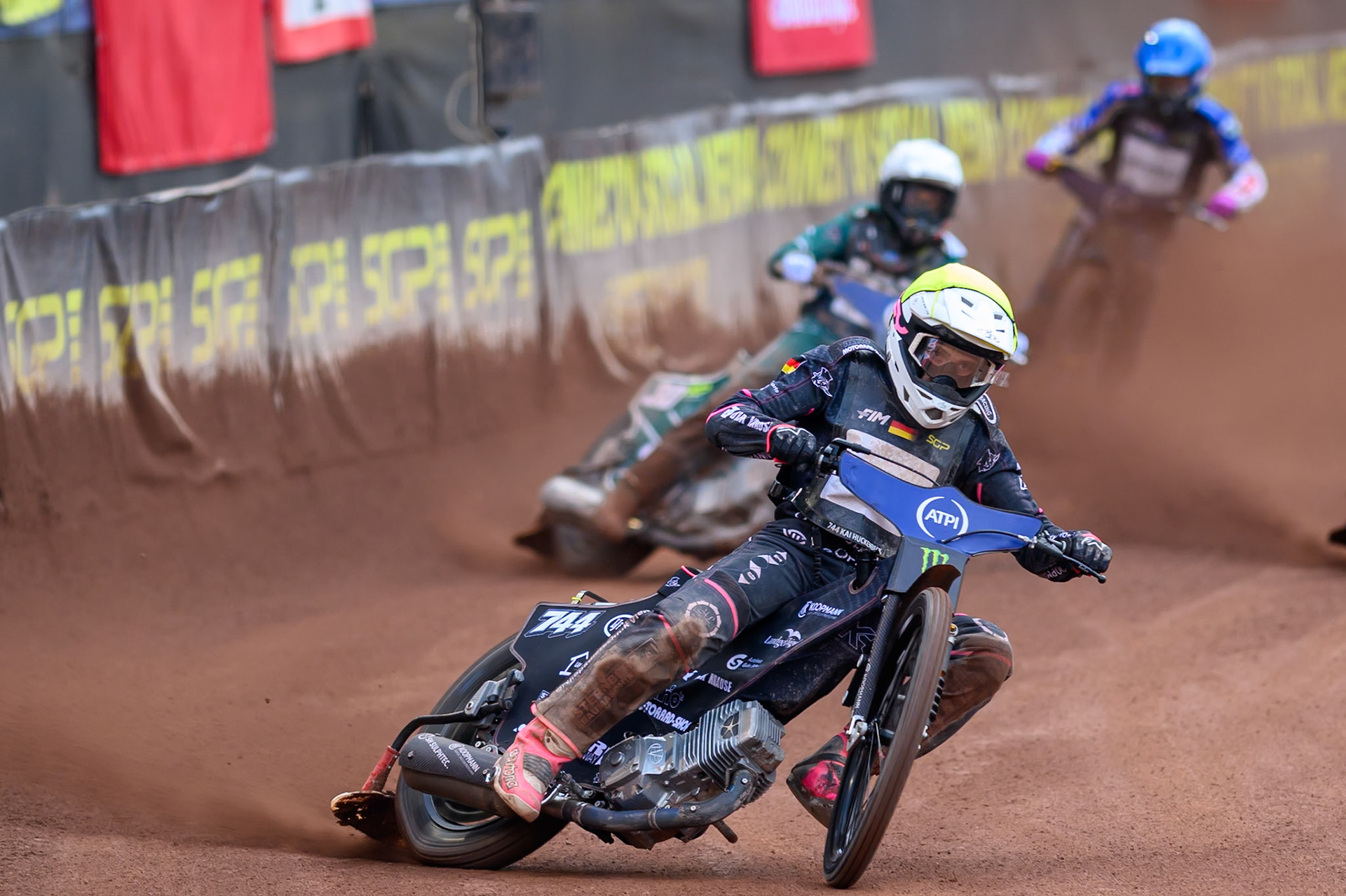 Kai Huckenbeck (744) of Germany in Yellow leading Leon Madsen (30) of Denmark in White and Jason Doyle (69) of Australia in Blue during the ATPI  FIM Speedway GP of Manchester at the National Speedway Stadium, Manchester on Saturday 6th June 2026. (Photo: Ian Charles | MI News)
