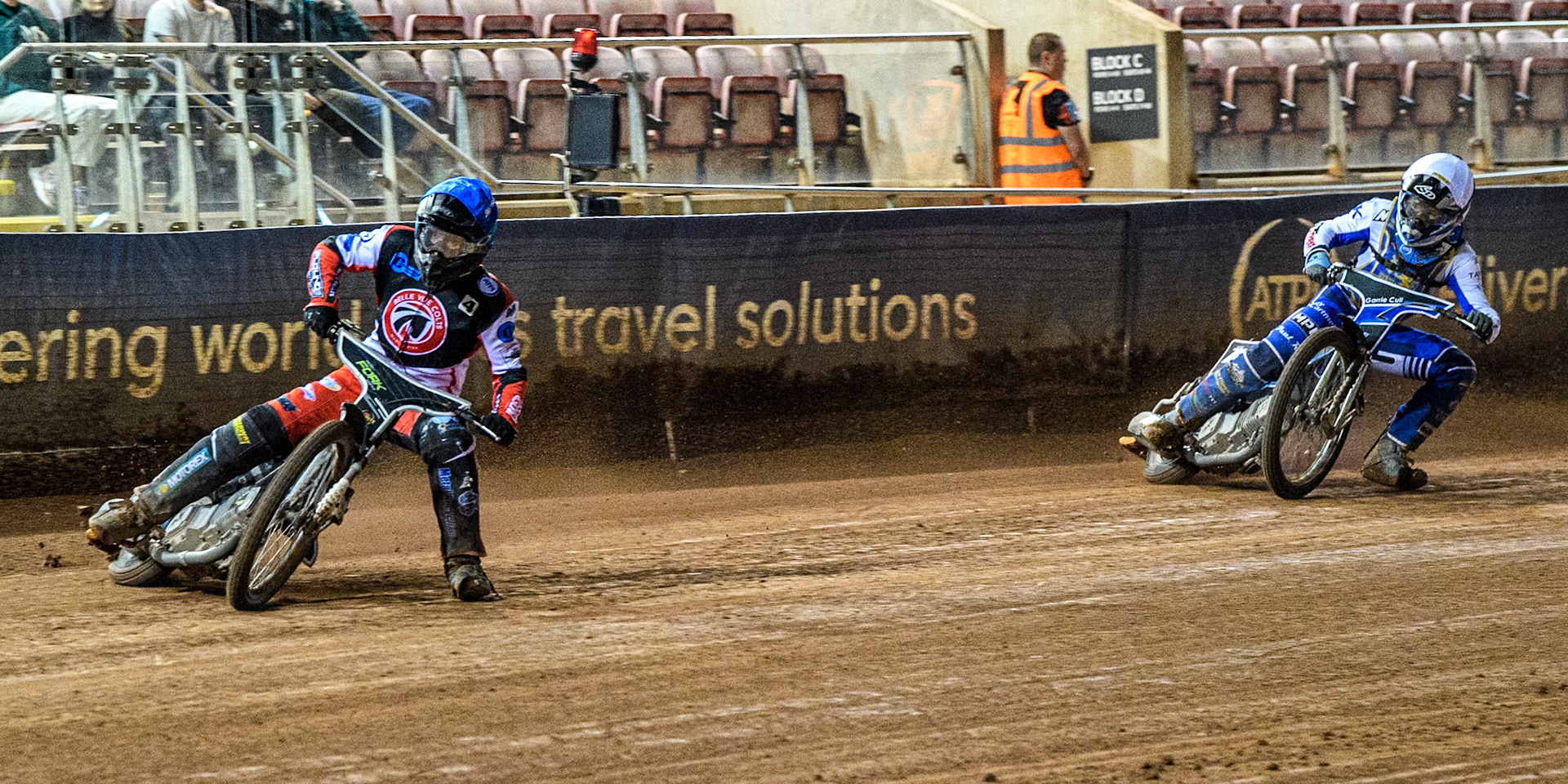 Belle Vue Colts' Matt Marson in Blue leading Edinburgh Monarchs' Sam McGurk in White during the WSRA National Development League match between Belle Vue Aces and Edinburgh Monarchs at the National Speedway Stadium, Manchester on Friday 30th August 2024. (Photo: Ian Charles | MI News)