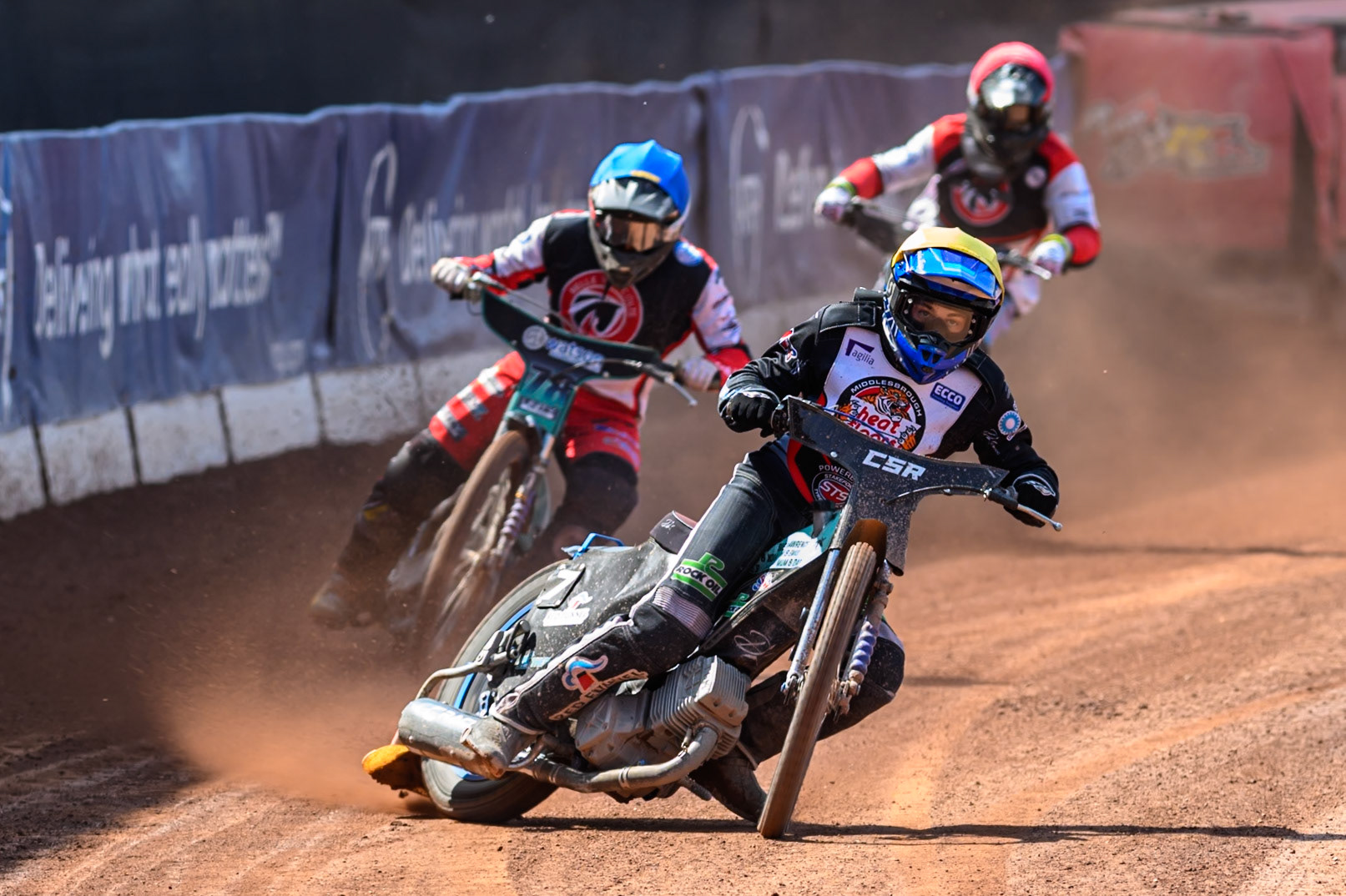 Charlie Southwick of Middlesborough Tigers  in Yellow leading Mason Watson of Belle Vue Colts  in Blue and Jack Kingston of Belle Vue Colts in Red during the WSRA National Development League match between Belle Vue Colts and Middlesbrough Tigers at the National Speedway Stadium, Manchester on Sunday 10th August 2025. (Photo: Mark Fletcher | MI News)