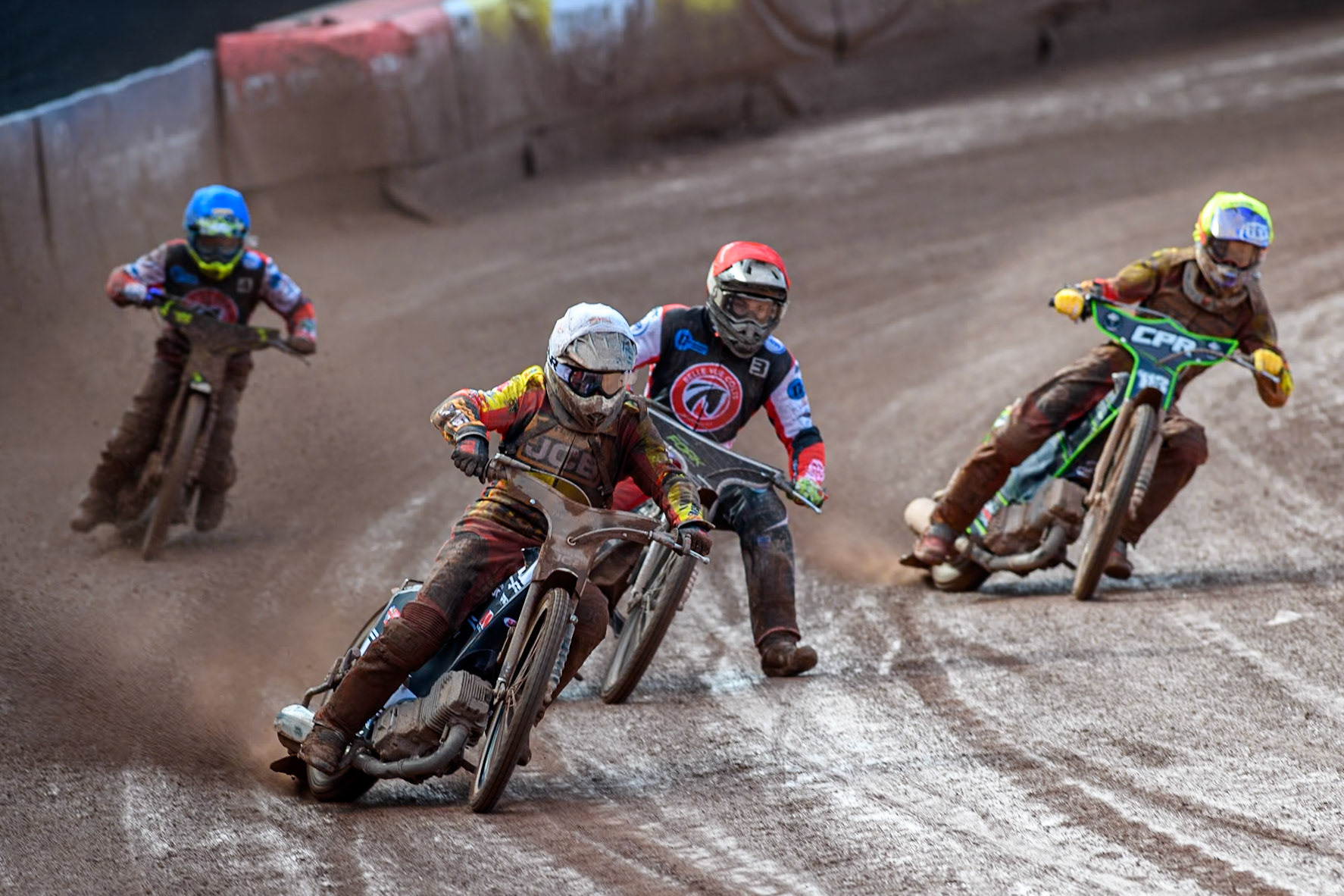 Leicester Lion Cubs' Joe Thompson (White) leads  Belle Vue Colts' Matt Marson (Red), Belle Vue Colts' Luke Muff (Blue) and Leicester Lion Cubs' Vinnie Foord (Yellow) during the WSRA  National Development League match between Belle Vue Colts and Leicester Lion Cubs at the National Speedway Stadium, Manchester on Friday 29th March 2024. (Photo: Ian Charles | MI News)