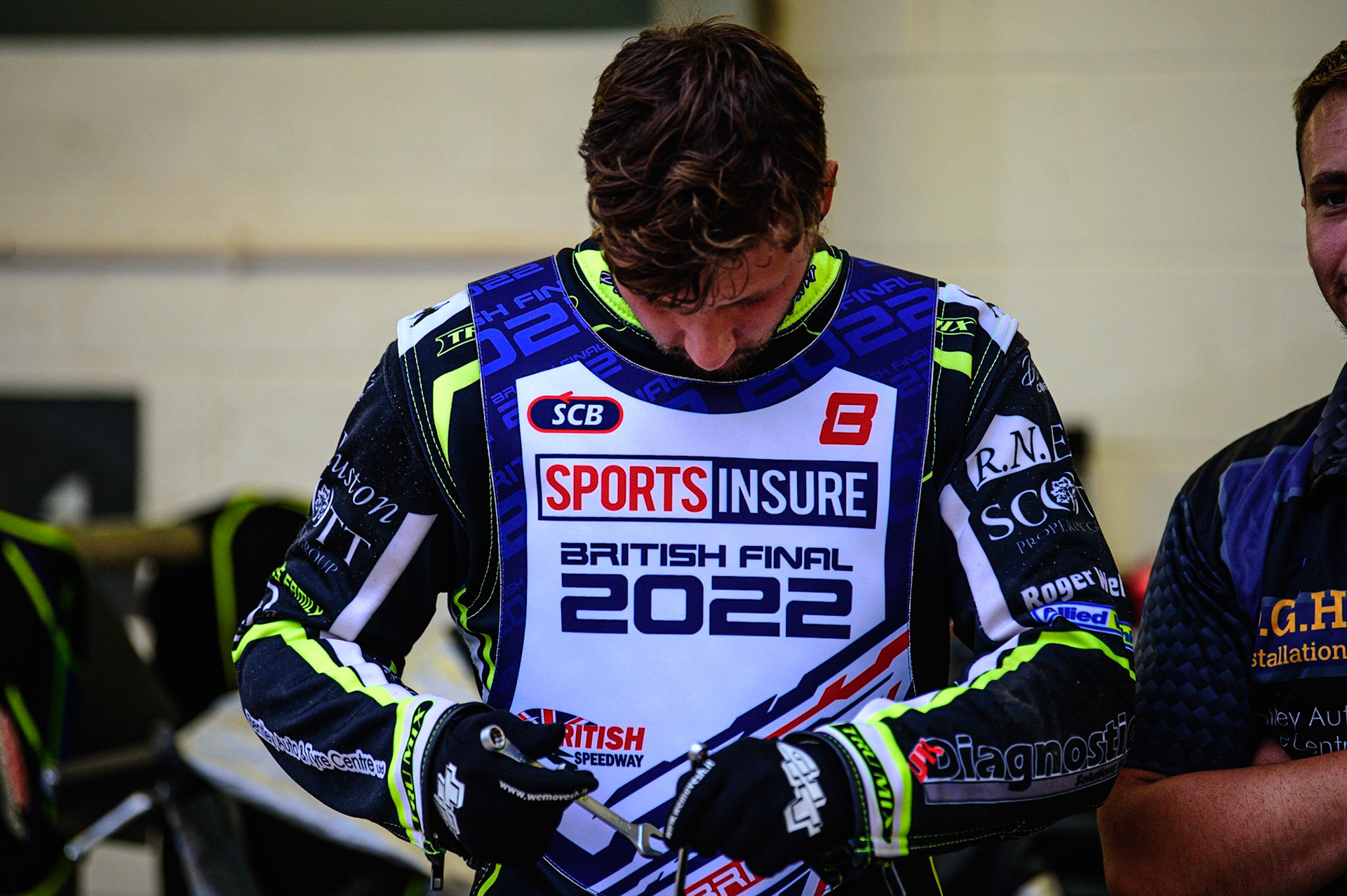 Danyon Hume works on his bike during the Sports Insure British Speedway Championship Final at the National Speedway Stadium, Bellevue, Manchester, England on Monday 1st August 2022. (Photo by: Ian Charles | MI News)