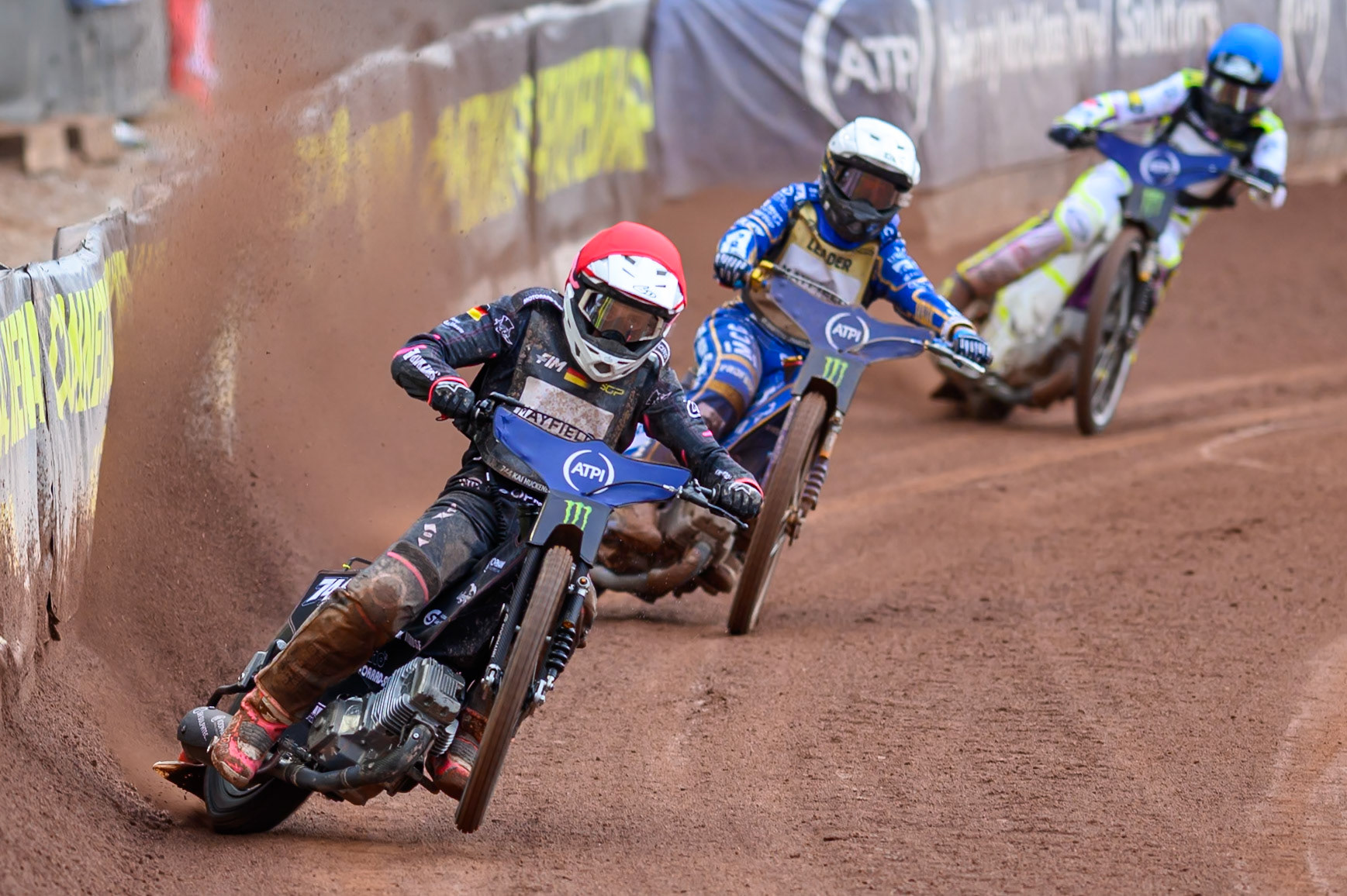 Kai Huckenbeck (744) of Germany in Red leading Bartosz Zmarzlik (95) of Poland in White and Wild Card Tom Brennan (16) of Great Britain in Blue during the ATPI  FIM Speedway GP of Manchester at the National Speedway Stadium, Manchester on Saturday 6th June 2026. (Photo: Ian Charles | MI News)