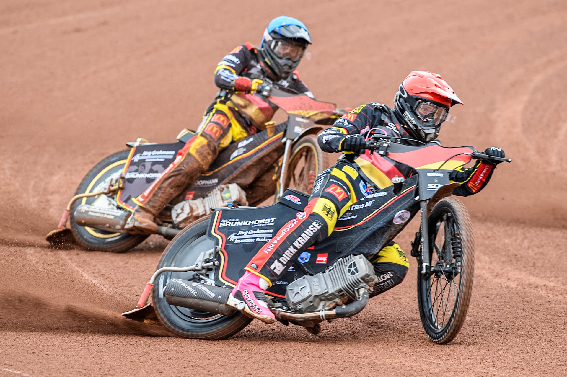 Kai Huckenbeck of Germany in Red leading team mate Norick Blödorn of Germany during the Monster Energy FIM Speedway of Nations Semi-Final 1 at the National Speedway Stadium, Manchester on Tuesday 9th July 2024. (Photo: Ian Charles | MI News)in Blue