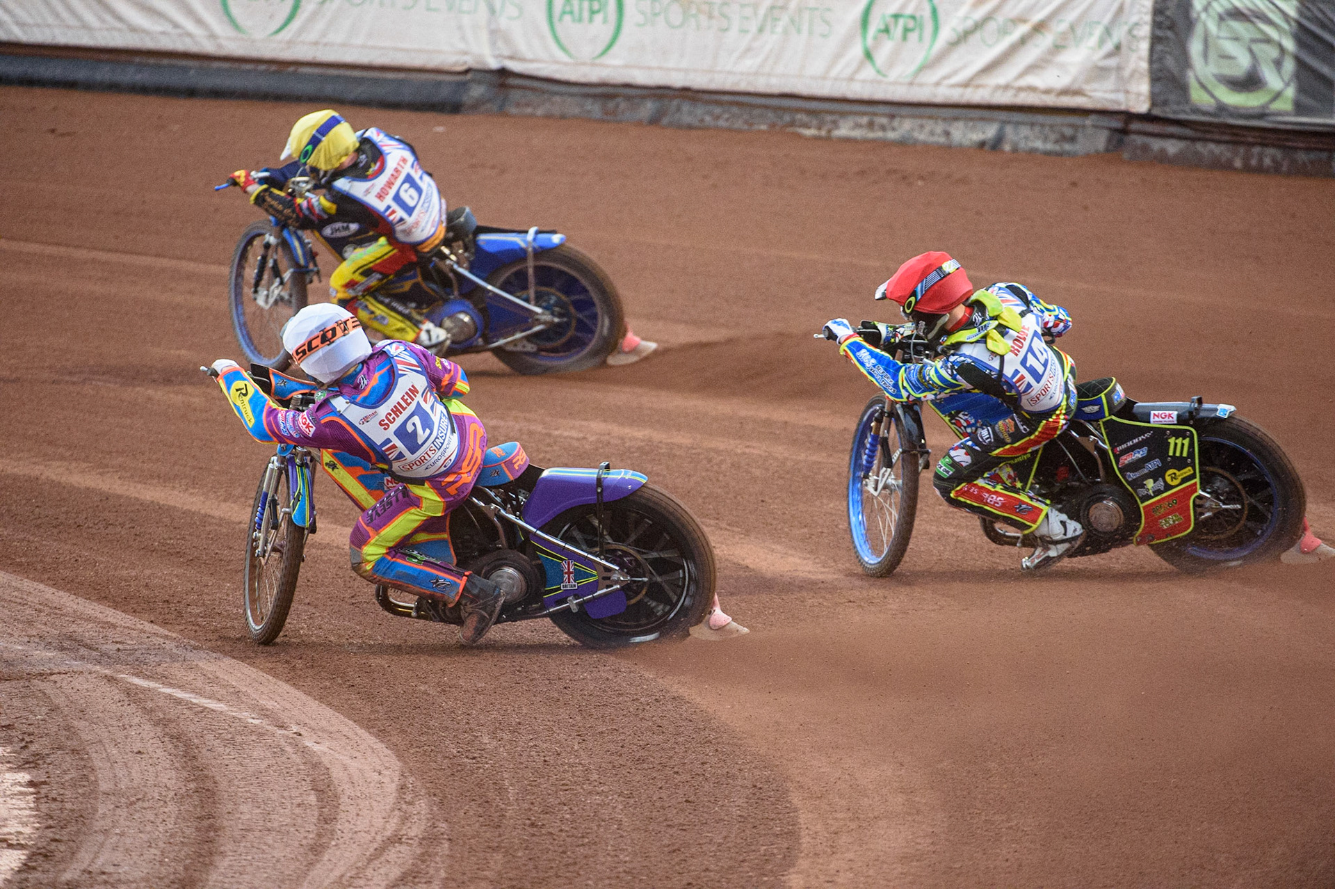 MANCHESTER, UK. AUGUST 16TH   Rory Schlein  (White) inside Anders Rowe  (Red) as they chase Kyle Howarth  (Yellow) during the Sports Insure British Speedway Finals at the National Speedway Stadium, Manchester on Monday 16th August 2021. (Credit: Ian Charles | MI News)