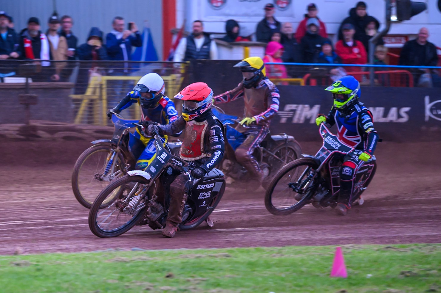 Maciej Janowski of Poland in Red rides inside Anders Rowe of Great Britain in White with Reserve Sam Hagon of Great Britain  in Blue and Adam Ellis of Great Britain in Yellow behind during the Speedway GP Qualifying Round 3 at Allied Ashfield Stadium, Glasgow on Saturday 30th May 2026. (Photo: Ian Charles | MI News)