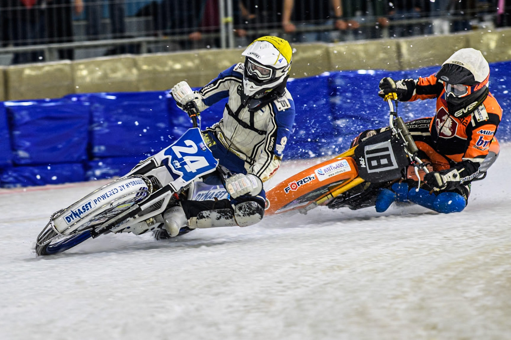 Finland's Max Koivula (24) in Yellow leading Reserve Czech Republic's Lukáš Hutla (18) in White during the FIM Ice Speedway Gladiators World Championship Final 3 at Ice Rink Thialf, Heerenveen on Saturday 6th April 2024. (Photo: Ian Charles | MI News)