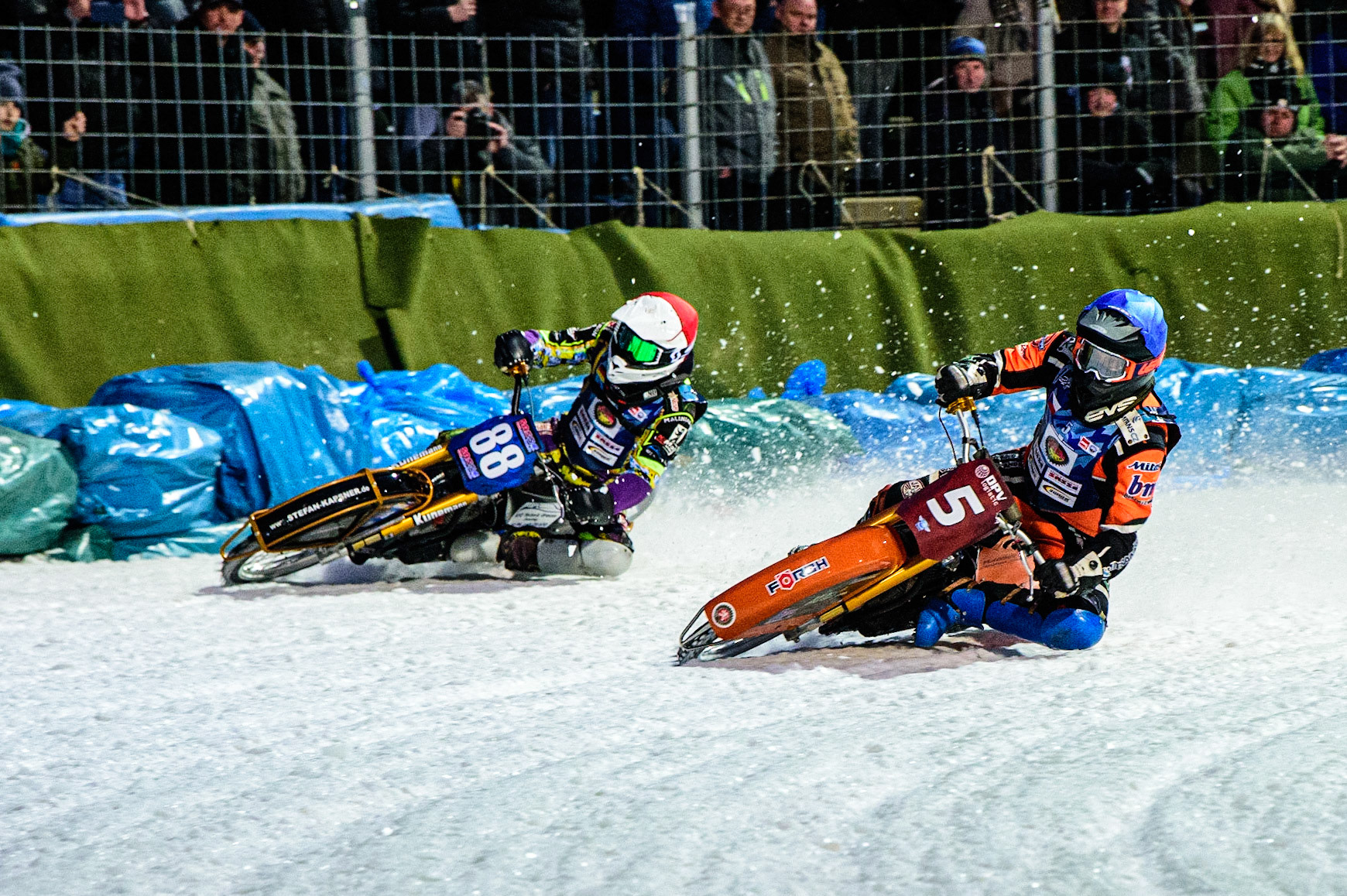 Lukas Hutla (Blue) inside Max Neidermaier (Red) during the German Individual Ice Speedway Championship at Horst-Dohm-Eisstadion, Berlin on Friday 3rd March 2023. (Photo: Ian Charles | MI News)