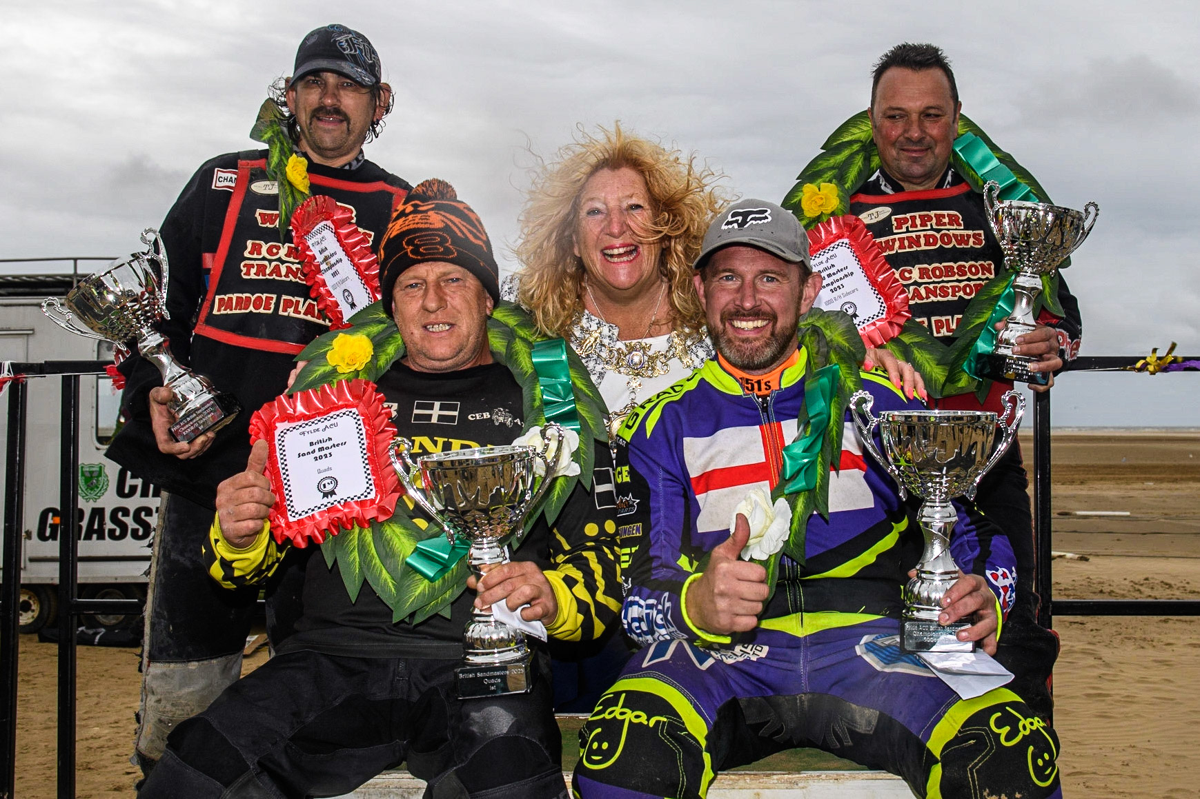 All the winners: Rear: Colin Blackbourn &amp; Carl Pugh (25), Front: Dan Bray (240) (left) Paul Cooper (11) with  Cllr Cheryl Little, The Worshipful Mayer of Fylde (right) in the centre during the Fylde ACU British Sand Racing Masters Championship at  St Annes on Sea, Lancashire on Sunday 30th July 2023. (Photo: Ian Charles | MI News)