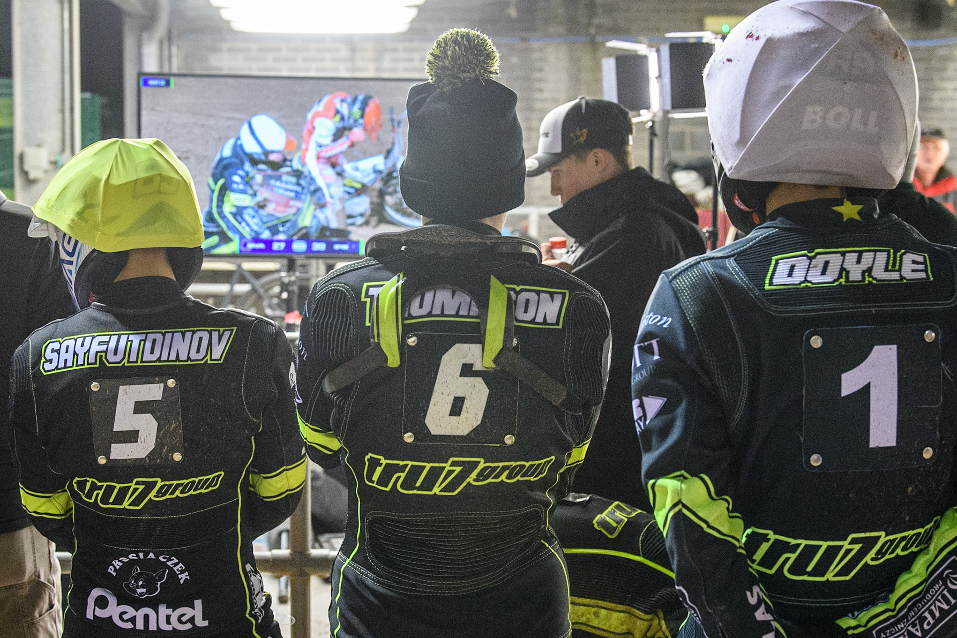 (L to R) Emil Sayfutdinov, Dan Thompson and Jason Doyle of Ipswich Witches watch the BSN Screen during the Premiership Cup Quarter Final 1st Leg match between Belle Vue Aces and Ipswich Witches at the National Speedway Stadium, Manchester on Monday 24th March 2025. (Photo: Ian Charles | MI News)