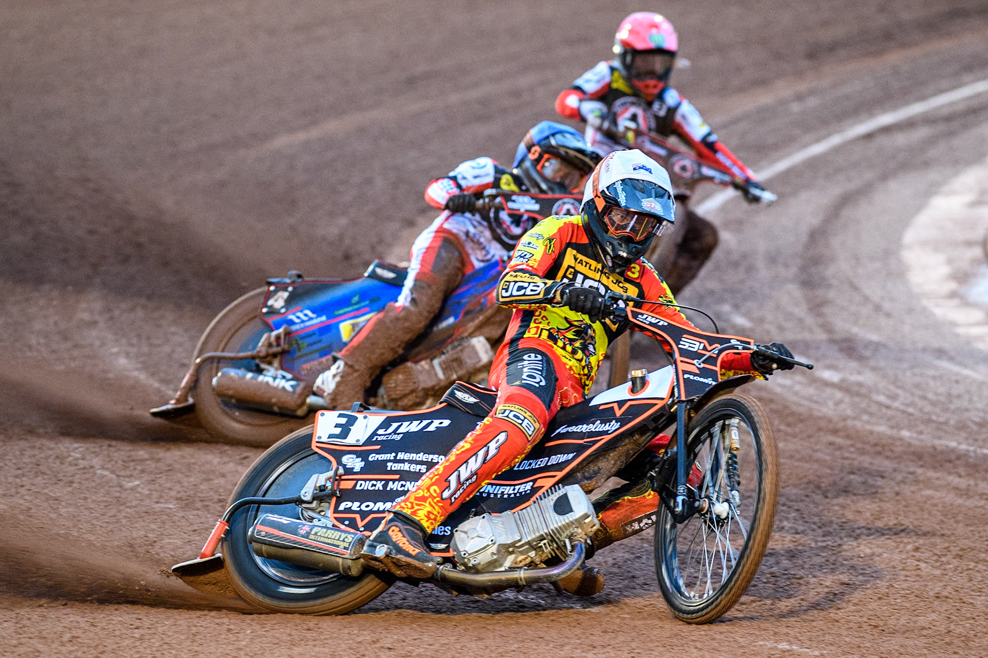 Sam Masters of Leicester Lions in White leading Ben Cook of Belle Vue Aces in Blue and Jaimon Lidsey of Belle Vue Aces in Red during the Rowe Motor Oil Premiership match between Belle Vue Aces and Leicester Lions at the National Speedway Stadium, Manchester on Saturday 6th April 2024. (Photo: Ian Charles | MI News)