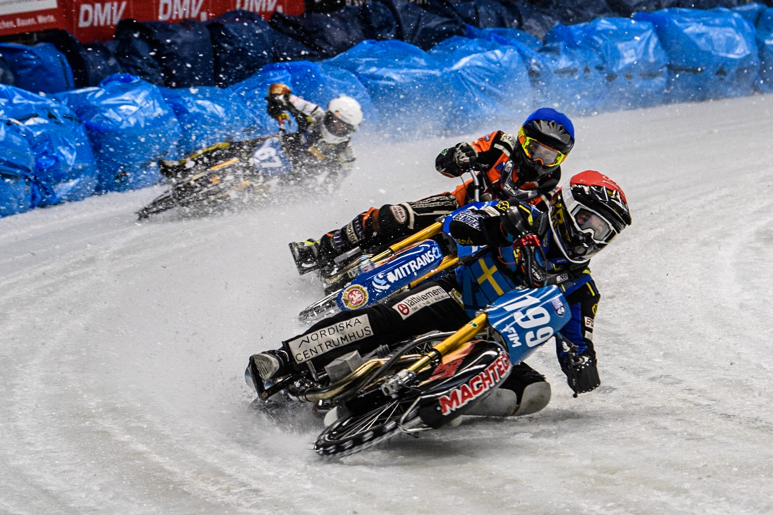 Martin Haarahiltunen (199) of Sweden in Red leading Lukas Hutla (212) of the Czech Republic in Blue and Heikki Huusko (67) of Finland in White during the Ice Speedway Gladiators World Championship Final 2 at Max-Aicher-Arena, Inzell on Sunday 16th March 2025. (Photo: Ian Charles | MI News)