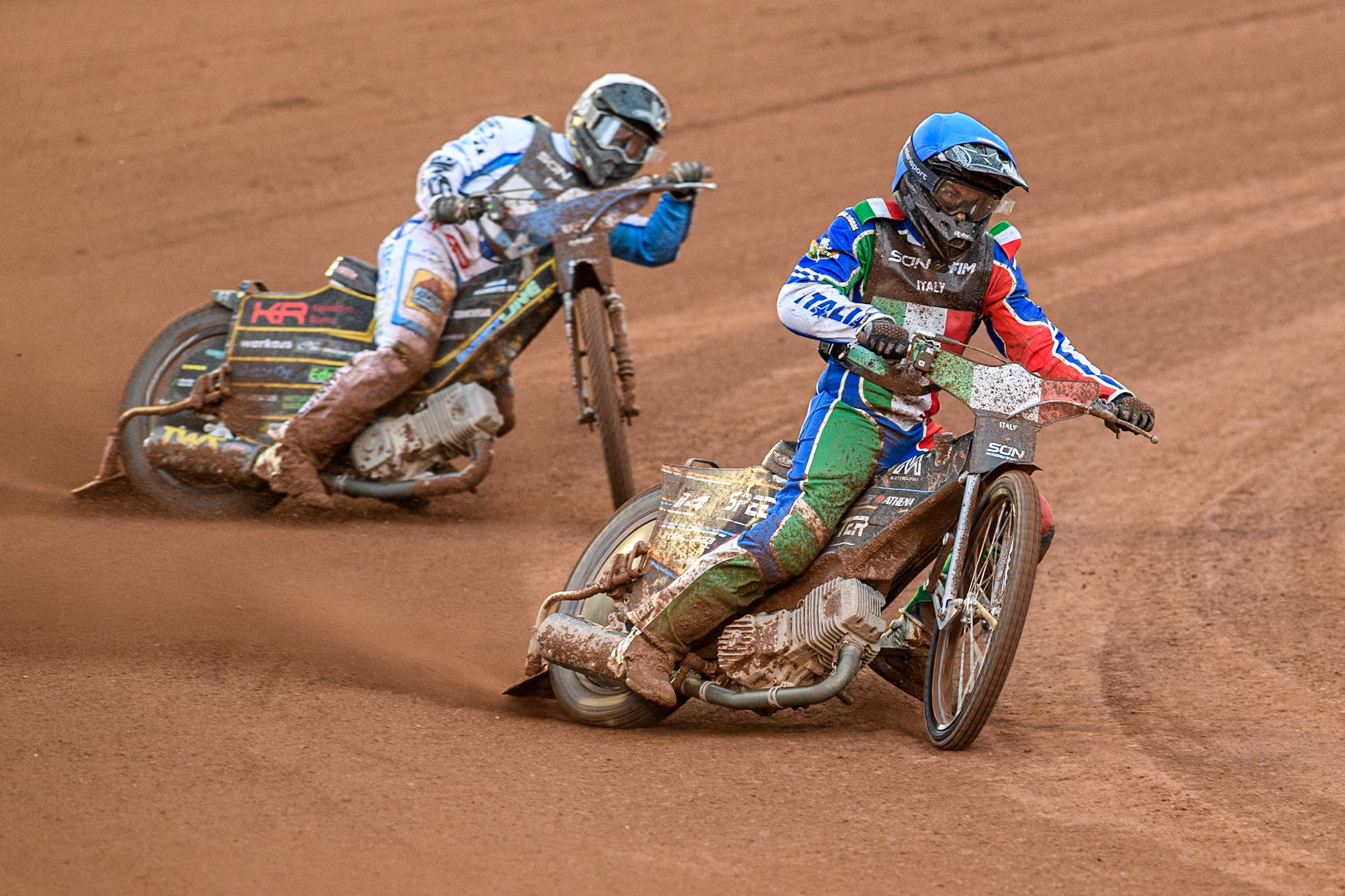 Nicolas Vicentin of Italy in Blue leading Jesse Mustonen of Finland in White during the Monster Energy FIM Speedway of Nations Semi-Final 1 at the National Speedway Stadium, Manchester on Tuesday 9th July 2024. (Photo: Ian Charles | MI News)