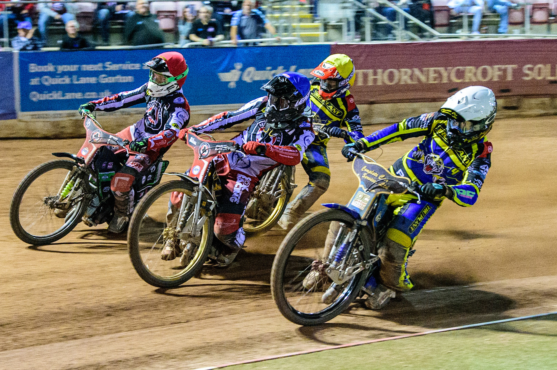 Kyle Howarth  (White) inside Norick Blodorn   (Blue) Charles Wright  (Red) with Connor Mountain  (Yellow) behind during the SGB Premiership match between Belle Vue Aces and Sheffield Tigers at the National Speedway Stadium, Manchester on Monday 5th September 2022. (Credit: Ian Charles | MI News)