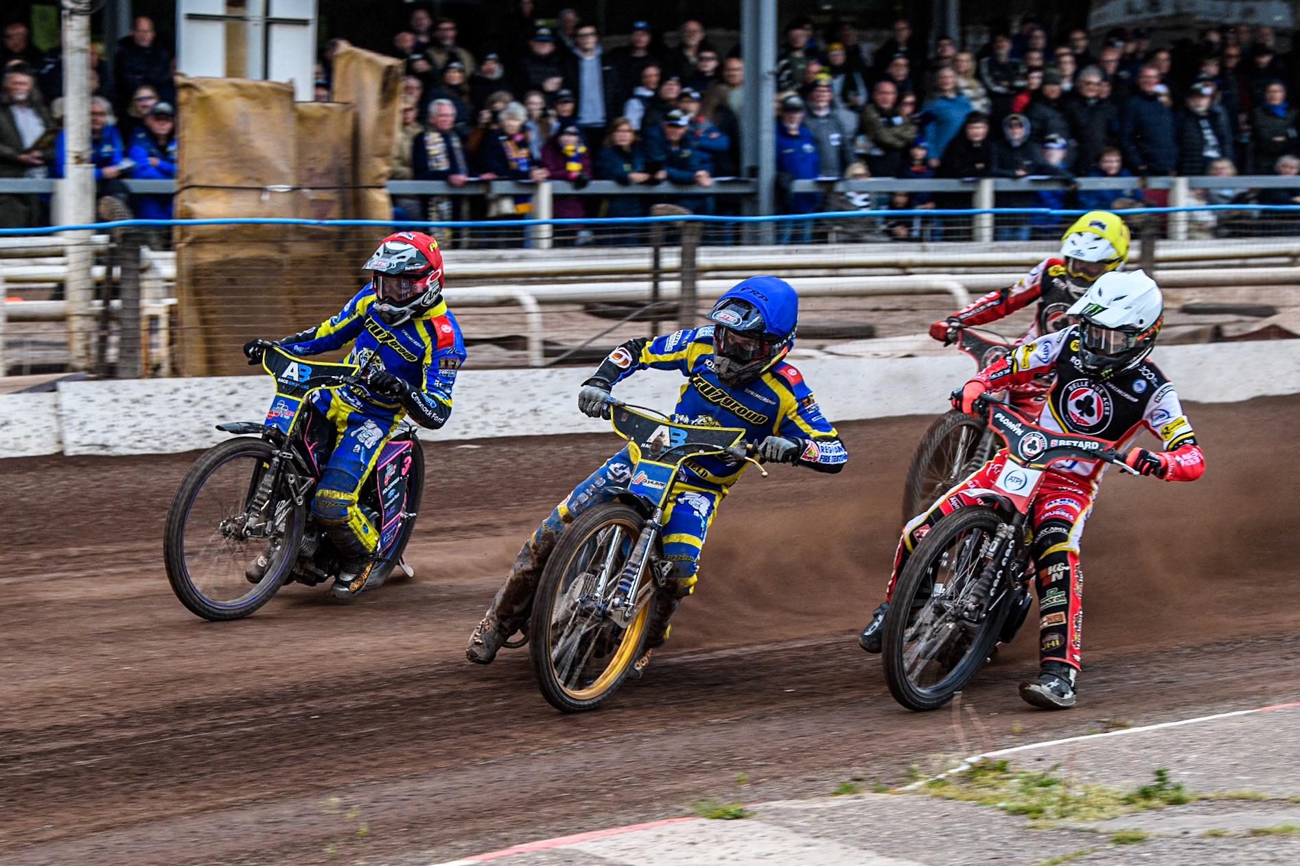 Justin Sedgmen of Sheffield Tigers in Blue and Josh Pickering of Sheffield Tigers in Red leading Dan Bewley of Belle Vue Aces in White and Tate Zischke of Belle Vue Aces in Yellow during the Rowe Motor Oil Premiership match between Sheffield Tigers and Belle Vue Aces at Owlerton Stadium, Sheffield on Monday 5th May 2025. (Photo: Ian Charles | MI News)