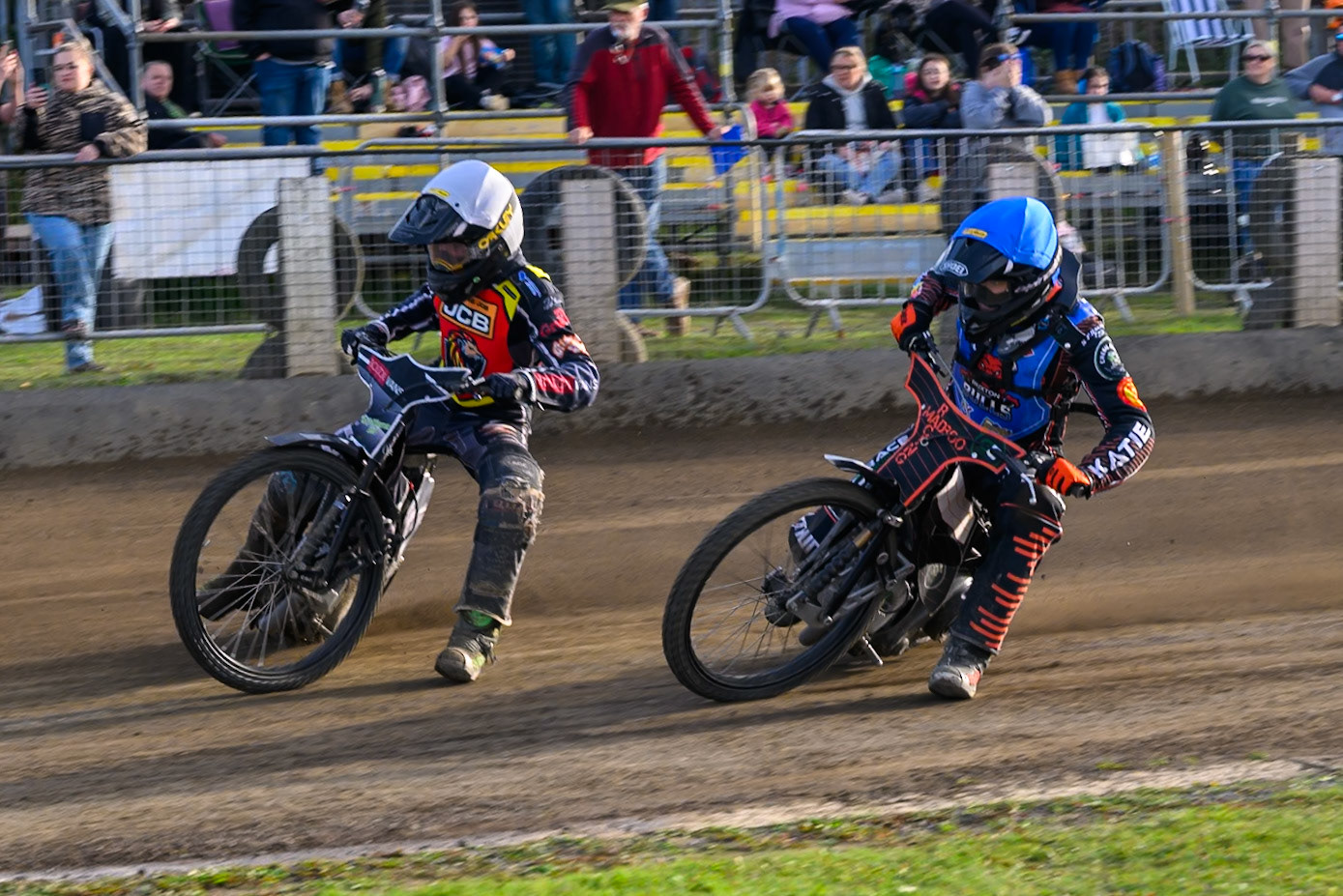 Bailey Fellows, Guest Rider for Buxton Bulls   in Blue on the inside of Seth Norman of Leicester Lion Cubs   in White during the WSRA National Development League match between Buxton Bulls and Leicester Lion Cubs at Hi-Edge Speedway, Buxton on Sunday 4th October 2026. (Photo: Ian Charles | MI News)