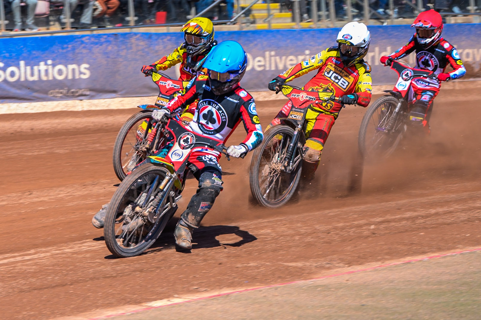 Tate Zischke of Belle Vue Aces  in Blue leading Kyle Howarth of Leicester Lions  in White, Joe Thompson of Leicester Lions in Yellow and Zach Cook of Belle Vue Aces  in Red during the Knockout Cup Northern Section match between Belle Vue Aces and Leicester Lions at the National Speedway Stadium, Manchester on Monday 6th April 2026. (Photo: Ian Charles | MI News)