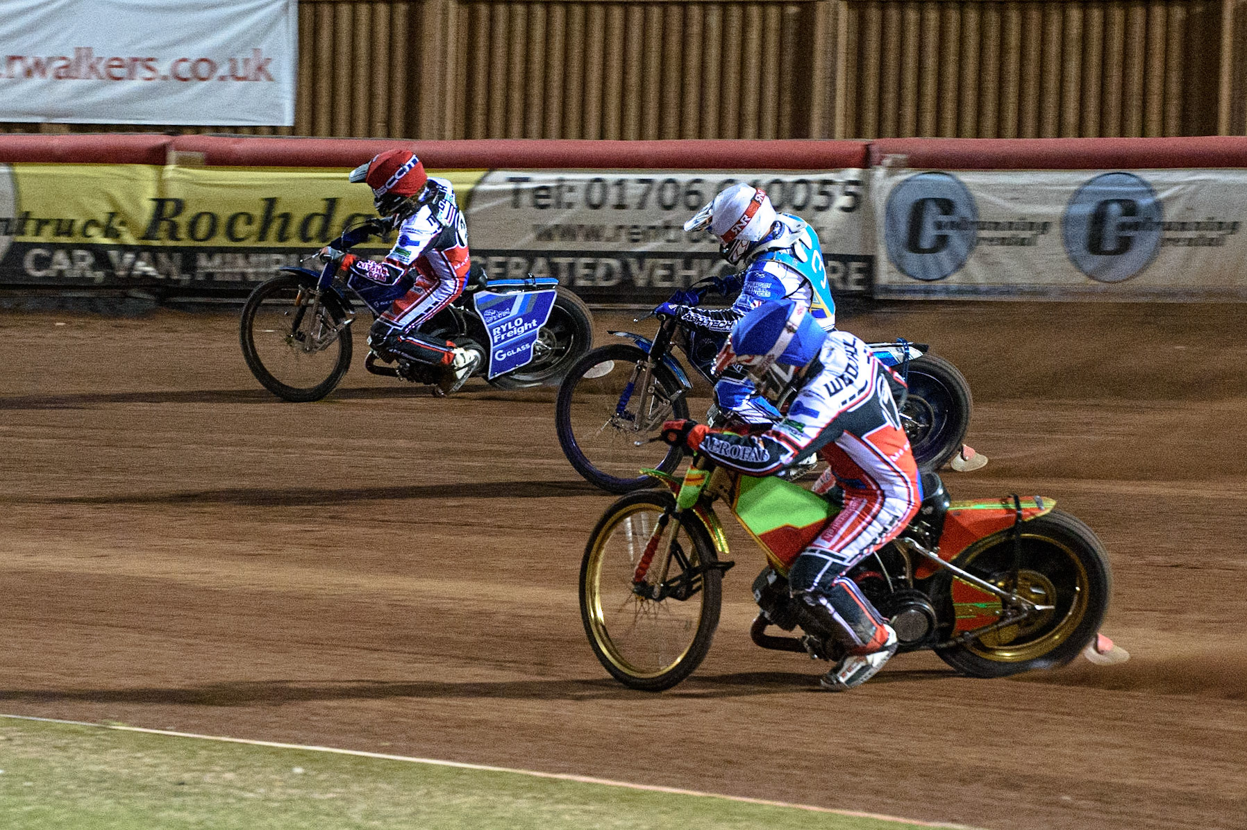 MANCHESTER, UK. AUGUST 20TH  Ben Woodhull  (Blue) chases Danny Phillips  (White) and Harry McGurk  (Red) during the National Development League match between Belle Vue Aces and Armadale Devils at the National Speedway Stadium, Manchester on Friday 20th August 2021. (Credit: Ian Charles | MI News)