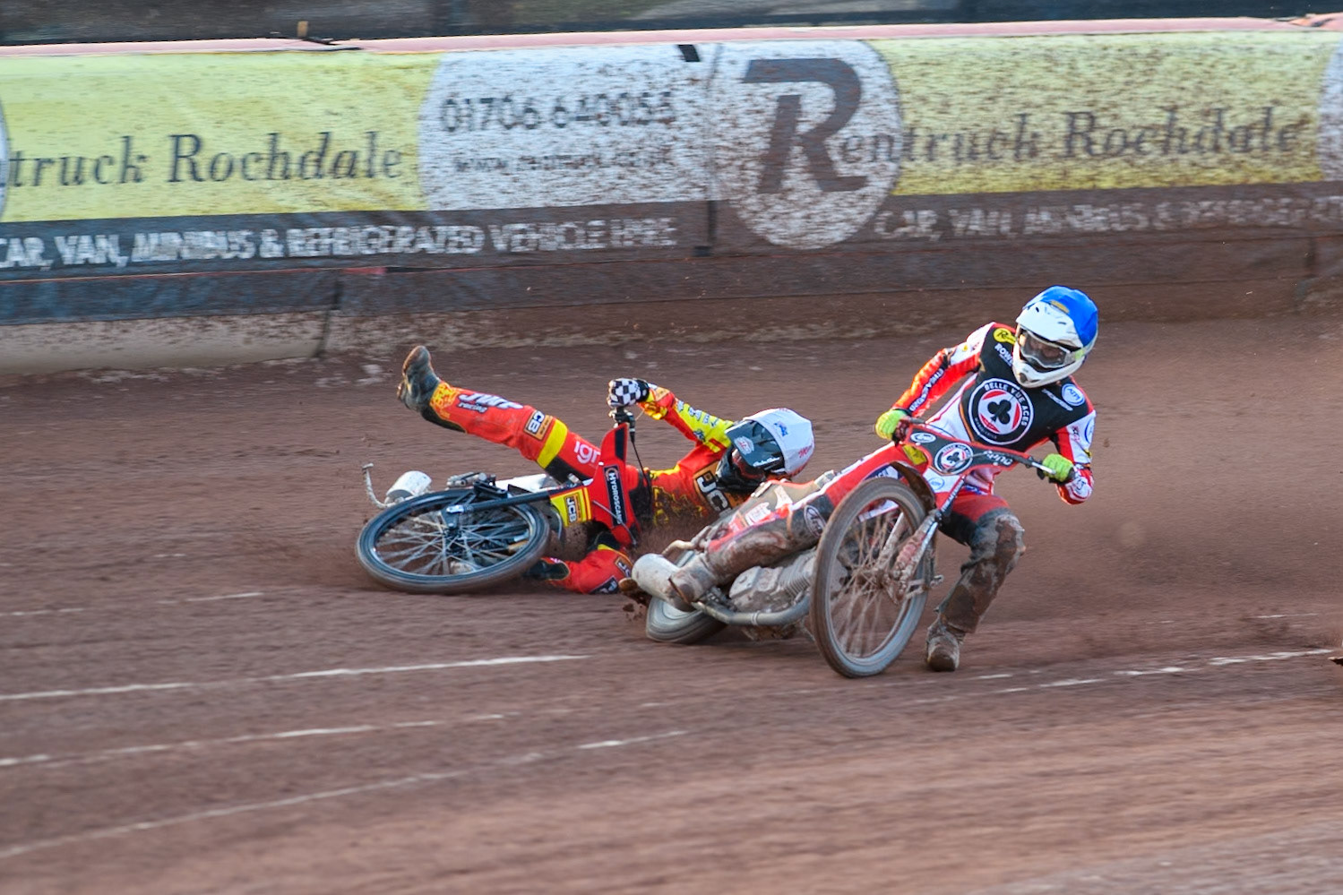 Leicester Lions' Sam Masters in White slides off outside of Belle Vue Aces' Jake Mulford in Blue during the Rowe Motor Oil Premiership match between Belle Vue Aces and Leicester Lions at the National Speedway Stadium, Manchester on Monday 19th May 2025. (Photo: Ian Charles | MI News)