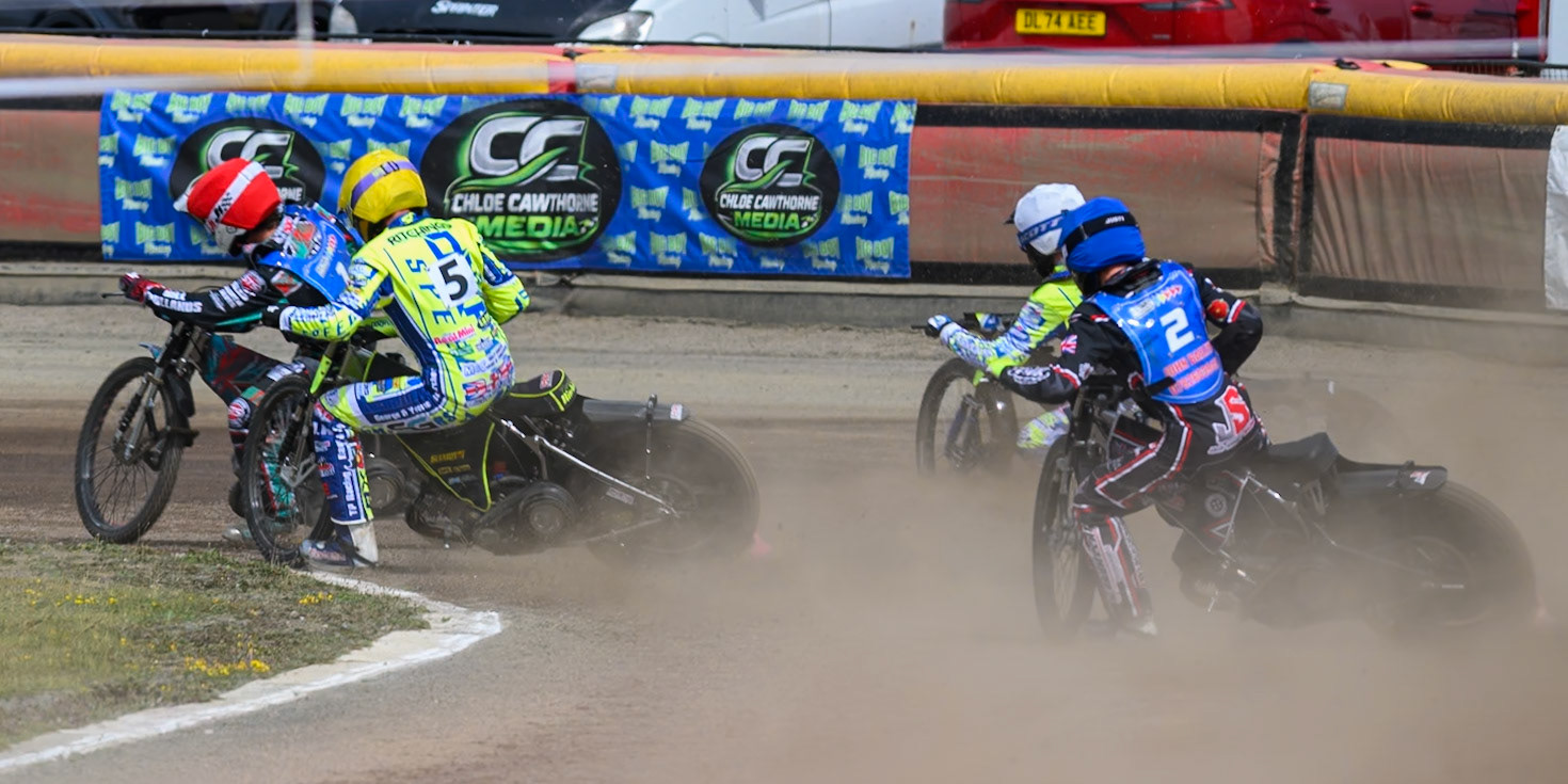 Alfie Bowtell of Buxton Bulls in Red leading Jody Scott of Oxford Chargers in White ,Darryl Ritchings of Oxford Chargers in Yellow  and Jack Shimelt of Buxton Bulls in Blue during the WSRA National Development League match between Buxton Bulls and Oxford Chargers at Hi-Edge Speedway, Buxton on Sunday 2nd August 2026. (Photo: Ian Charles | MI News)