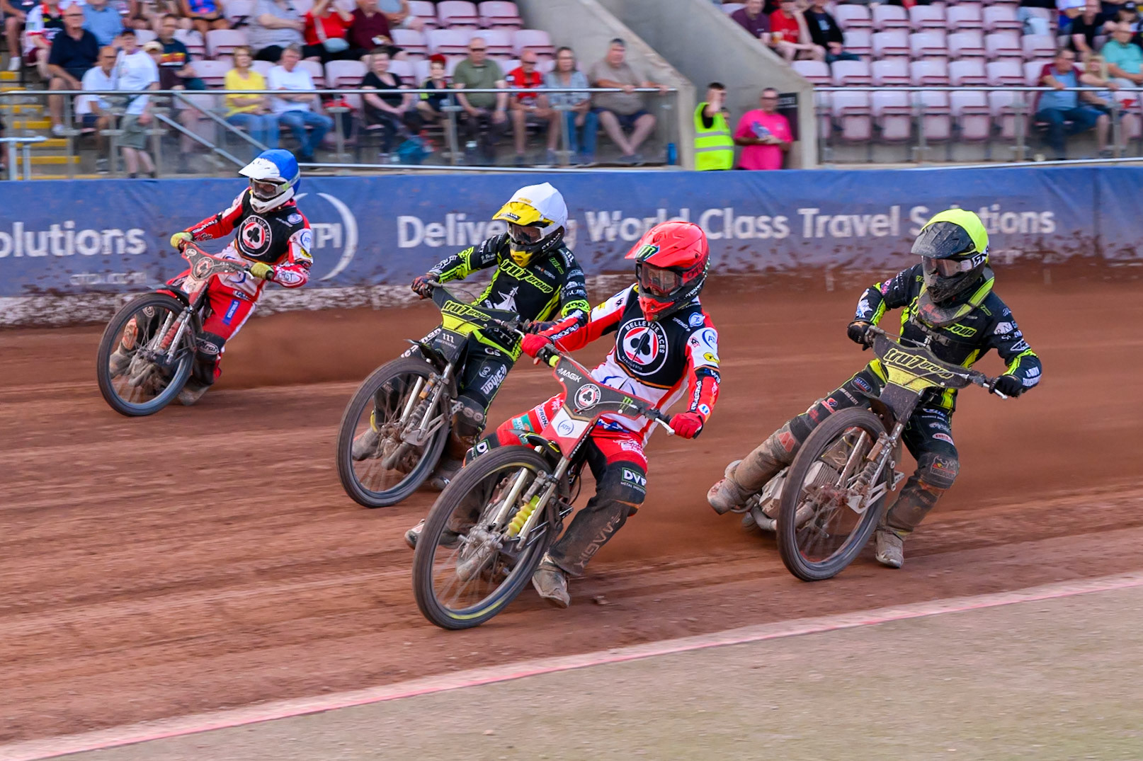 Belle Vue Aces' Jaimon Lidsey  in Red leading Ipswich Witches' Adam Ellis  in White, Ipswich Witches' Dan Thompson  in Yellow and Belle Vue Aces' Jake Mulford  in Blue during the Rowe Motor Oil Premiership match between Belle Vue Aces and Ipswich Witches at the National Speedway Stadium, Manchester on Monday 30th June 2025. (Photo: Ian Charles | MI News)