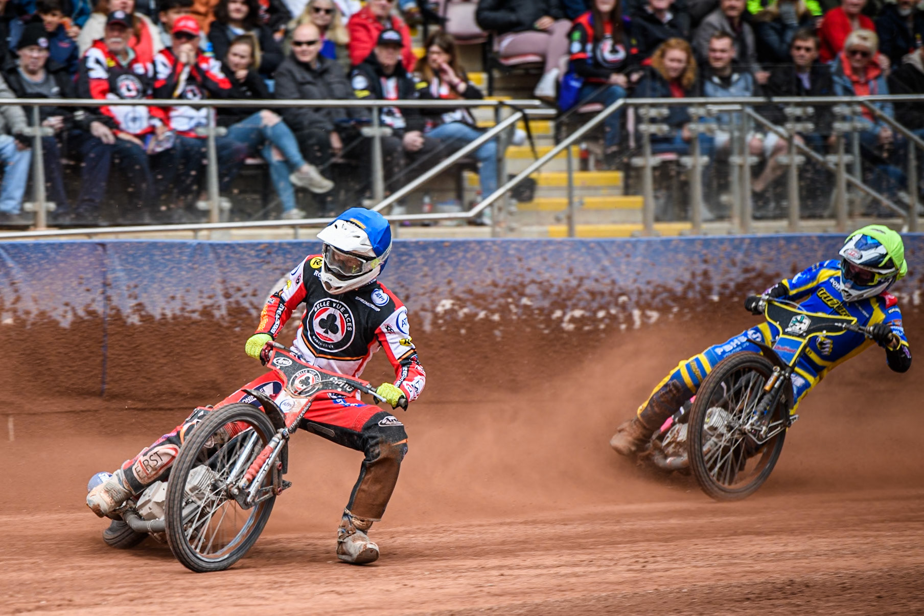 Jake Mulford of Belle Vue Aces in Blue leading Leon Flint of Sheffield Tigers in Yellow during the Rowe Motor Oil Premiership match between Belle Vue Aces and Sheffield Tigers at the National Speedway Stadium, Manchester on Monday 5th May 2025. (Photo: Ian Charles | MI News)