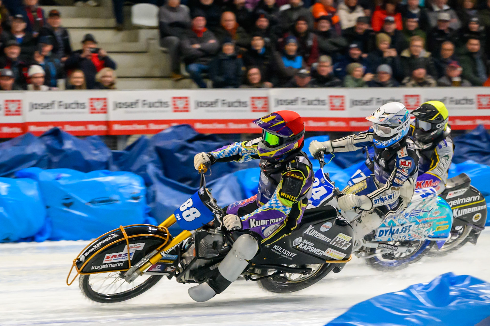Max Niedermaier (88) of Germany leading Max Koivula (24) of Finland  in White and Reserve Christoph Kirchner (17) of Germany in the second Re-Run of Heat 1 during the Ice Speedway Gladiators World Championship Final 2 at Max-Aicher-Arena, Inzell on Sunday 15th March 2026. (Photo: Ian Charles | MI News)