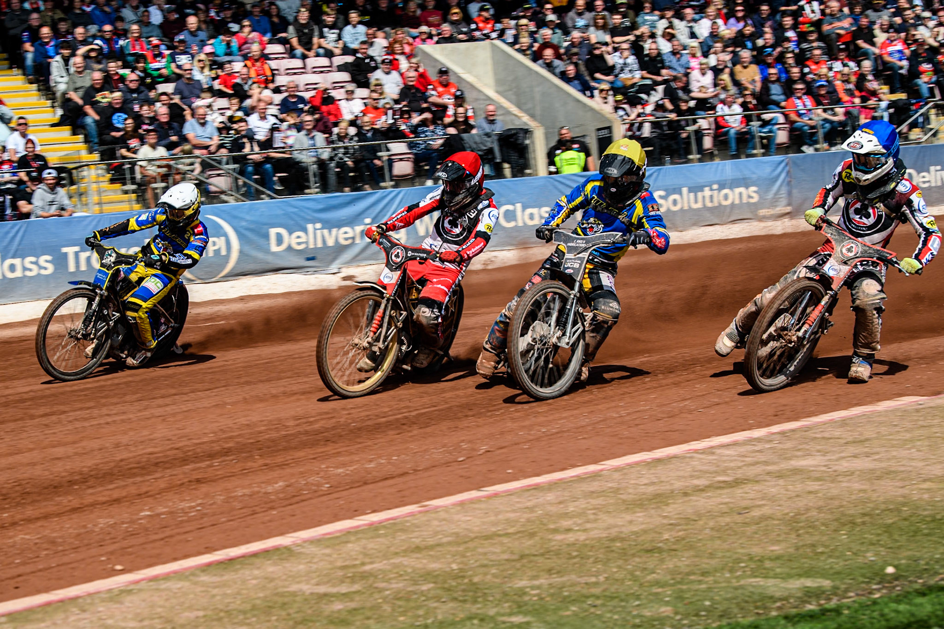 (L to R) Sheffield Tigers' Kyle Howarth  in White, Belle Vue Aces' Norick Blödorn in Red, Sheffield Tigers' Guest Rider Joe Thompson  in Yellow and Belle Vue Aces' Jake Mulford  in Blue during the Rowe Motor Oil Premiership match between Belle Vue Aces and Sheffield Tigers at the National Speedway Stadium, Manchester on Monday 26th August 2024. (Photo: Ian Charles | MI News)