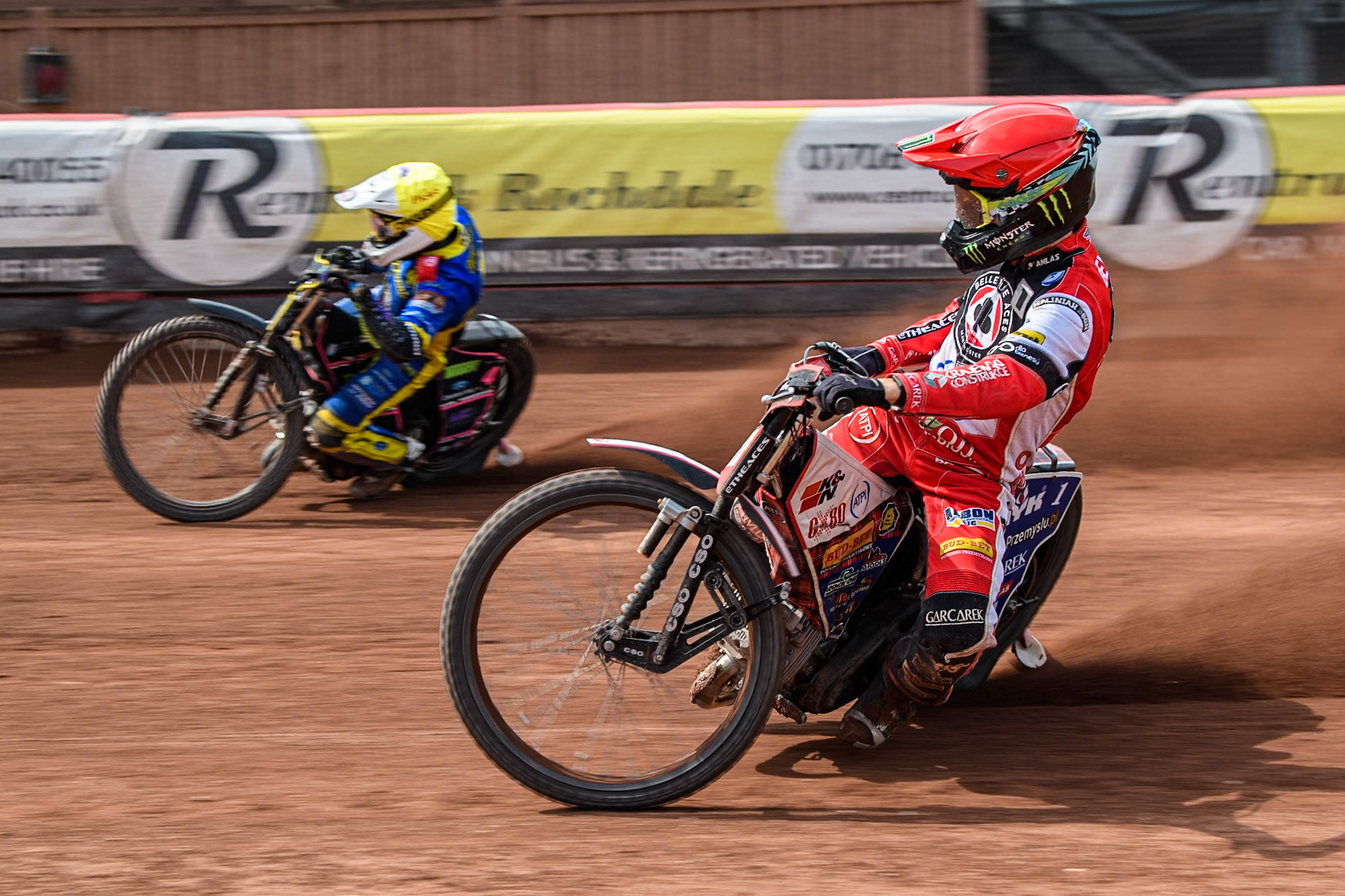 Belle Vue Aces' Dan Bewley   in Red rides inside Sheffield Tigers' Josh Pickering  in Yellow during the Rowe Motor Oil Premiership match between Belle Vue Aces and Sheffield Tigers at the National Speedway Stadium, Manchester on Monday 26th August 2024. (Photo: Ian Charles | MI News)