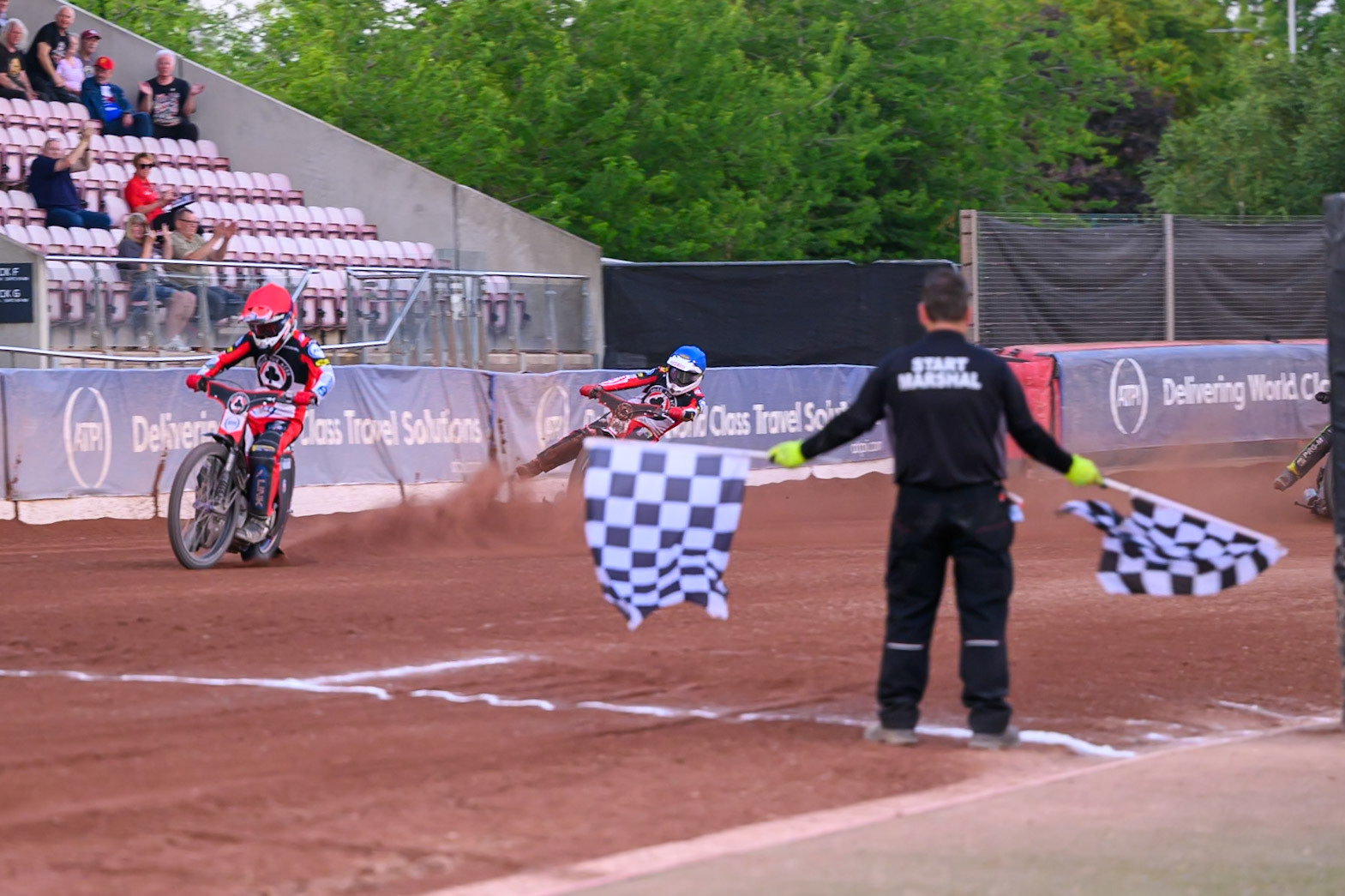 Zach Cook of Belle Vue Aces and Peter Kildemand of Belle Vue Aces in Blue cross the finish line for maximum points during the Rowe Motor Oil Premiership match between Belle Vue Aces and Ipswich Witches at the National Speedway Stadium, Manchester on Saturday 20th June 2026. (Photo: Ian Charles | MI News)