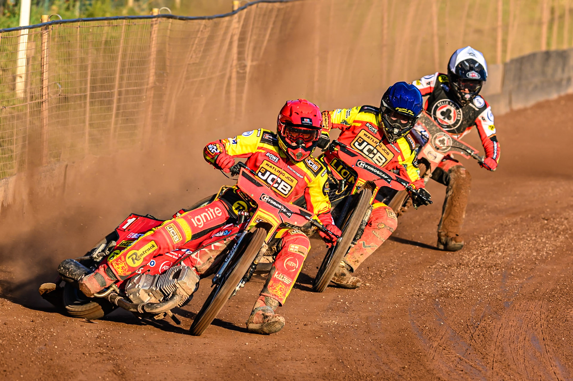 Leicester Lions' Max Fricke in Red leading Leicester Lions' Kyle Howarth in Blue and Belle Vue Aces' Zach Cook in White during the Rowe Motor Oil Premiership match between Leicester Lions and Belle Vue Aces at the Hydroscand Arena, Leicester on Thursday 19th June 2025. (Photo: Ian Charles | MI News)