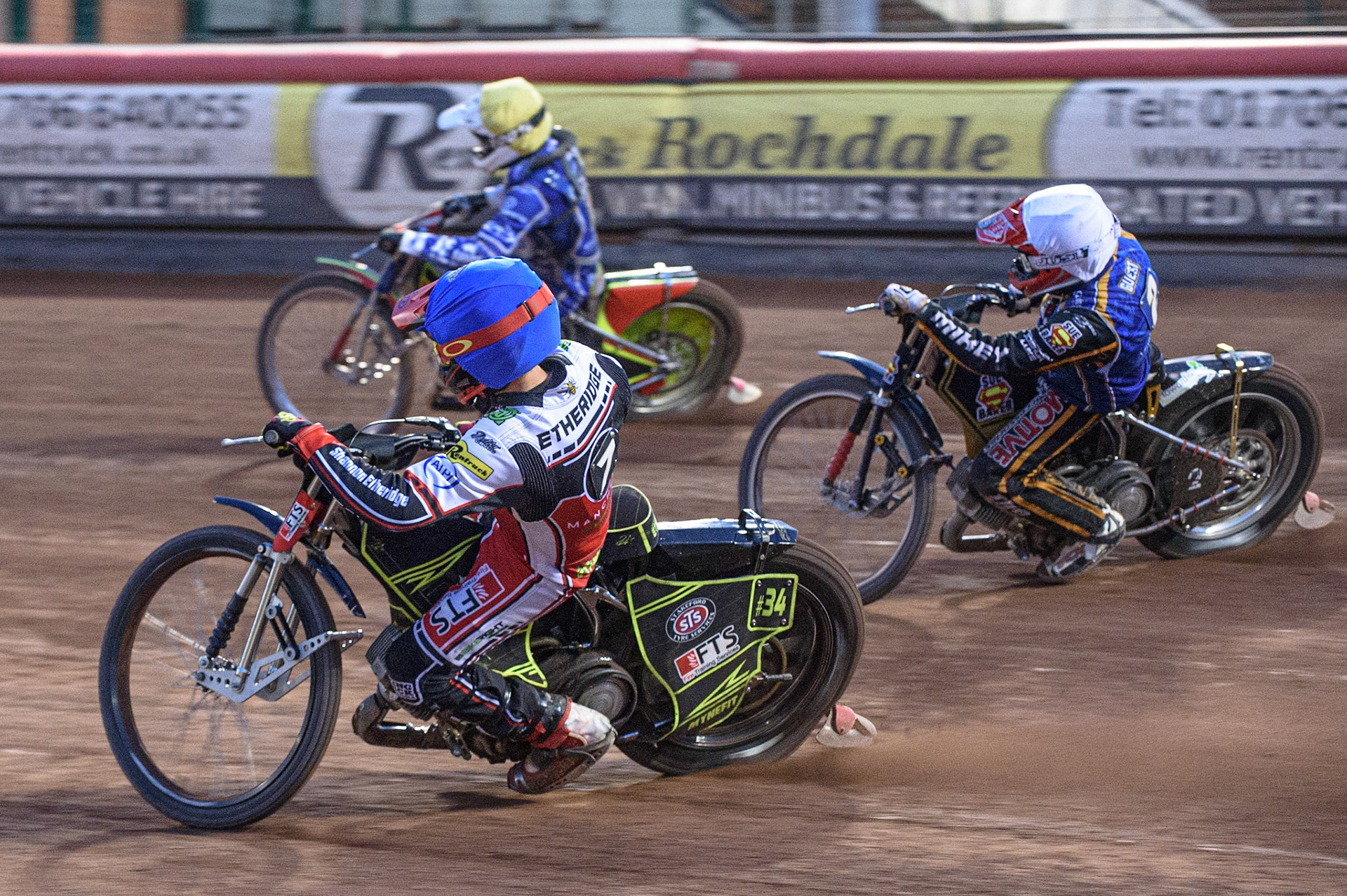MANCHESTER, UK. AUGUST 23RD    Jye Etheridge  (Blue) inside Kasper Andersen  (Yellow) and Ben Barker  (White) during the SGB Premiership match between Belle Vue Aces and King's Lynn Stars at the National Speedway Stadium, Manchester on Monday 23rd August 2021. (Credit: Ian Charles | MI News)