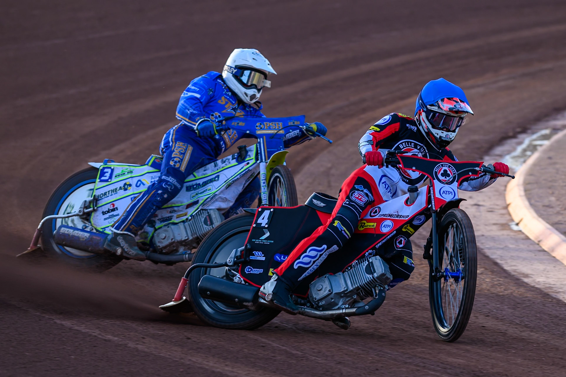 Zach Cook of Belle Vue Aces in Blue leading Chris Harris of Kings Lynn Stars in White during the Rowe Motor Oil Premiership match between Belle Vue Aces and King's Lynn Stars at the National Speedway Stadium, Manchester on Monday 10th August 2026. (Photo: Ian Charles | MI News)